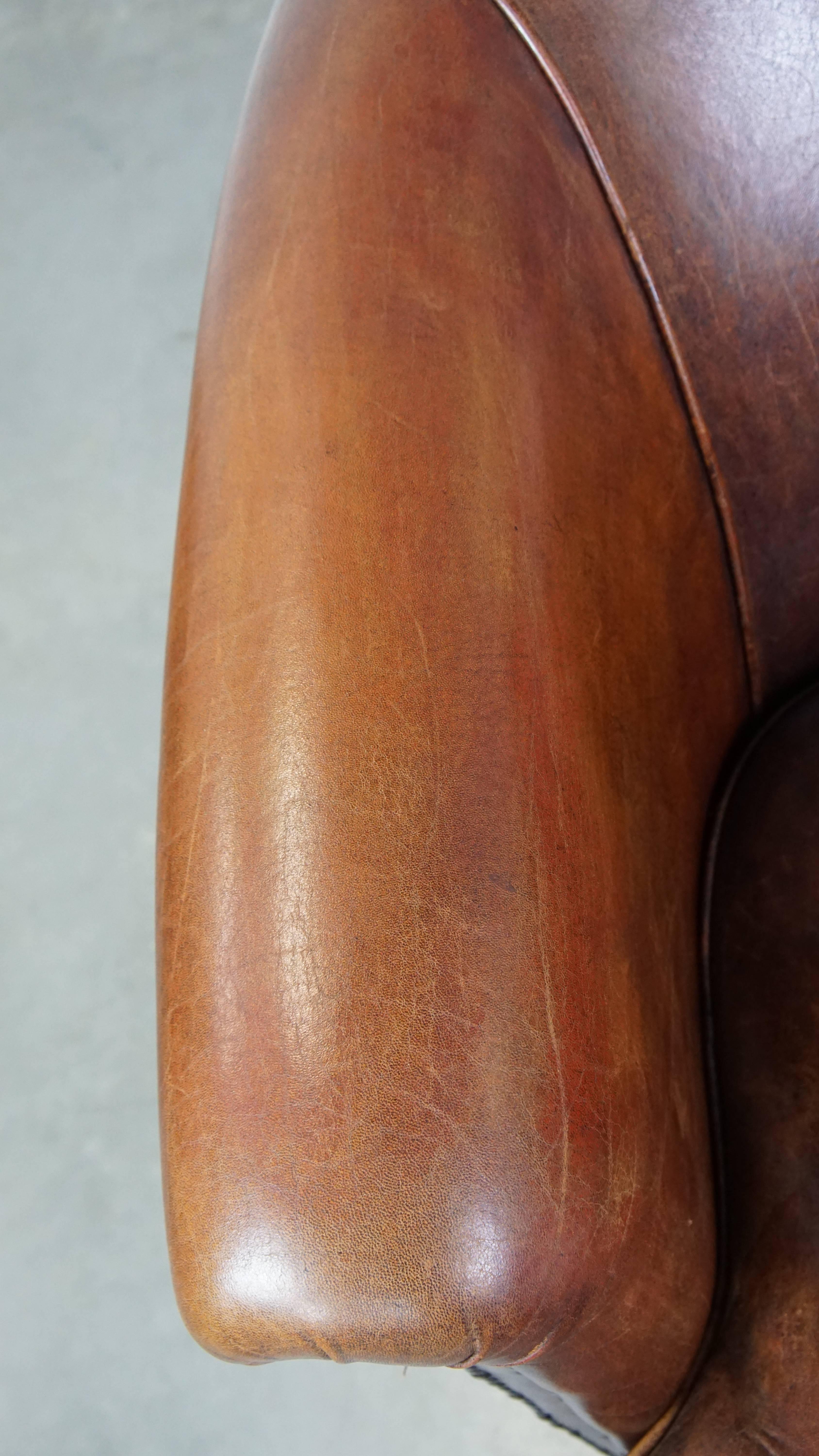 Tough, characterful, and comfortable cognac-colored sheepskin club armchair For Sale 1