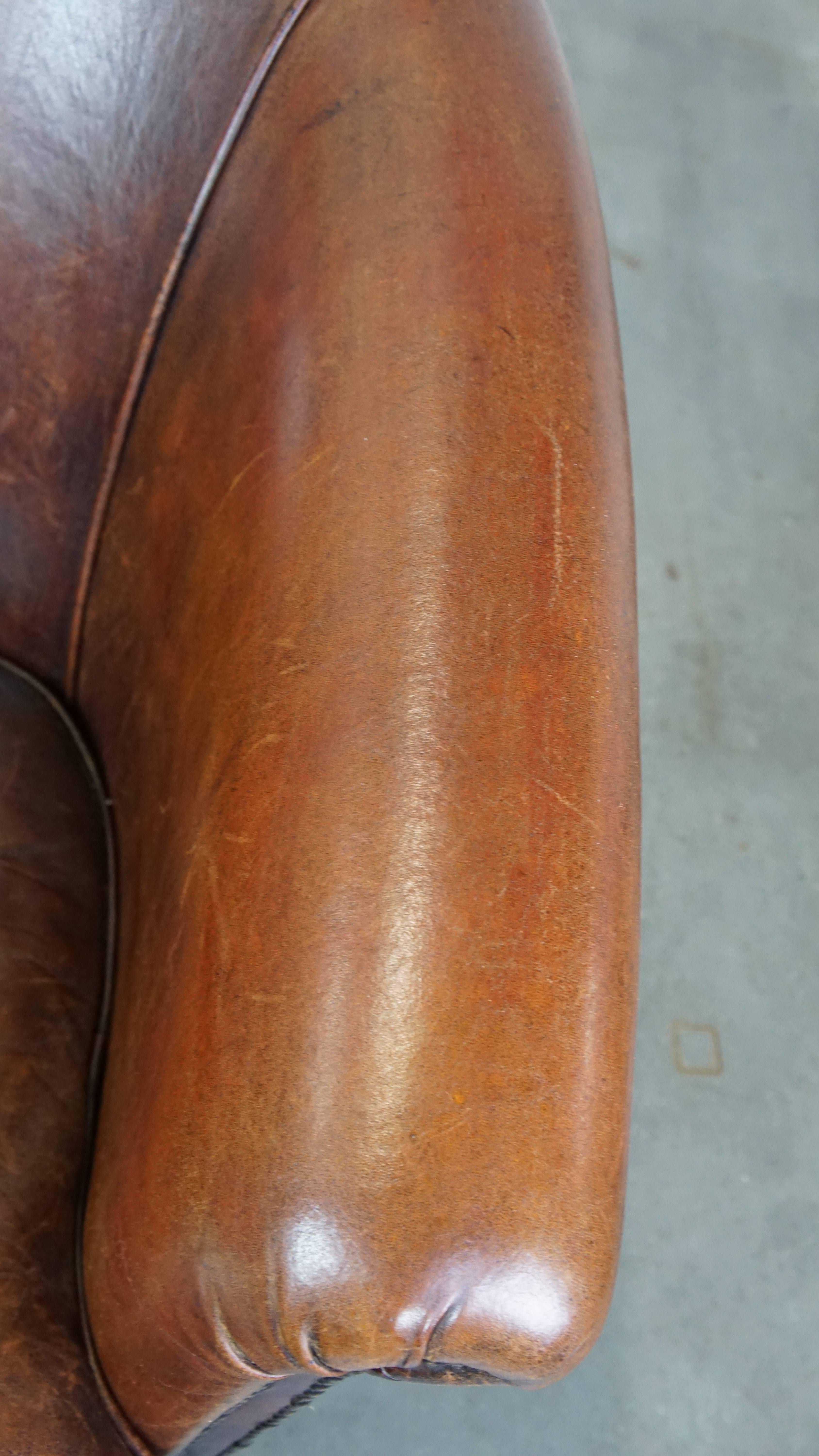 Tough, characterful, and comfortable cognac-colored sheepskin club armchair For Sale 2
