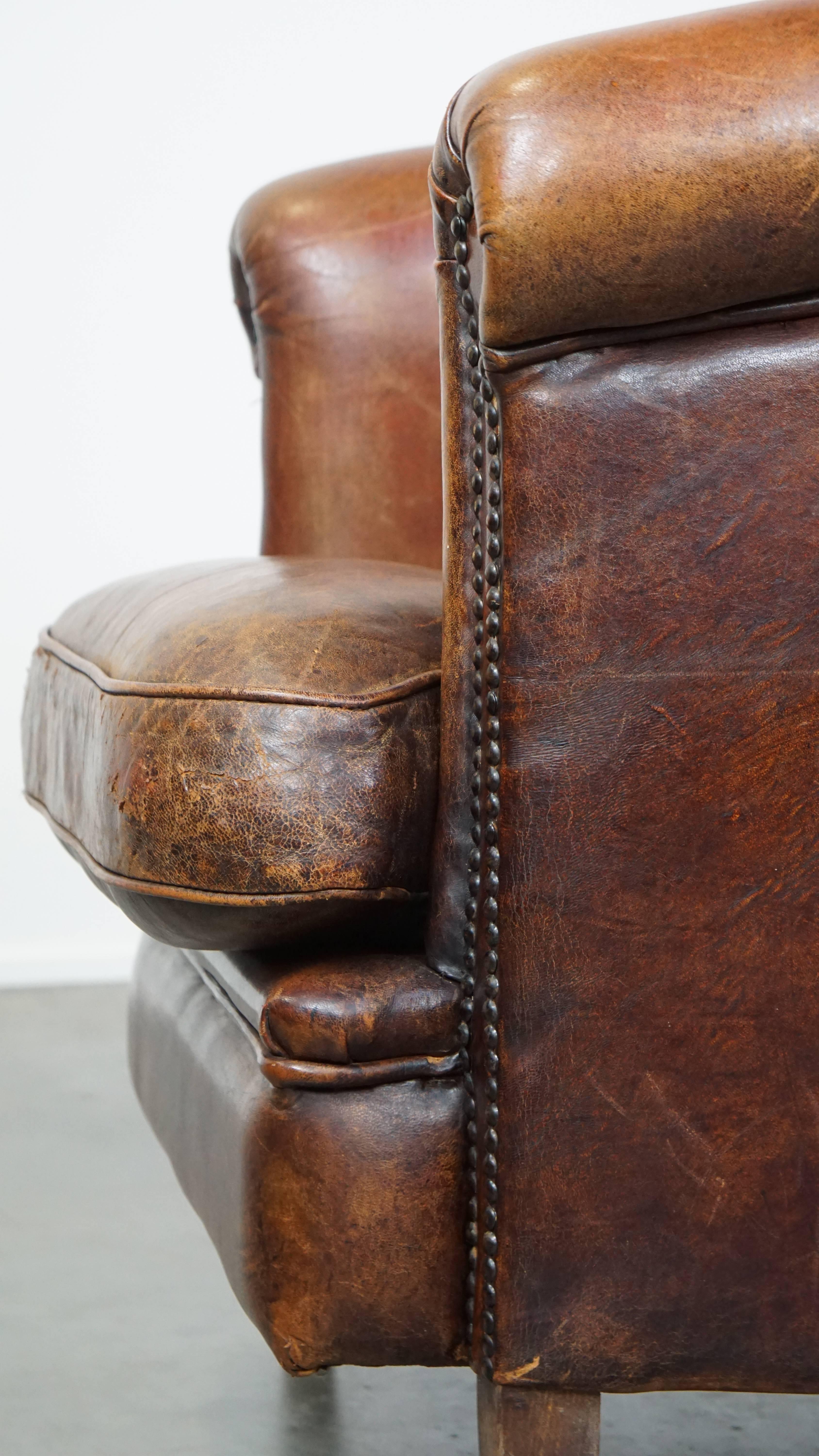 Tough, characterful, and comfortable cognac-colored sheepskin club armchair For Sale 3