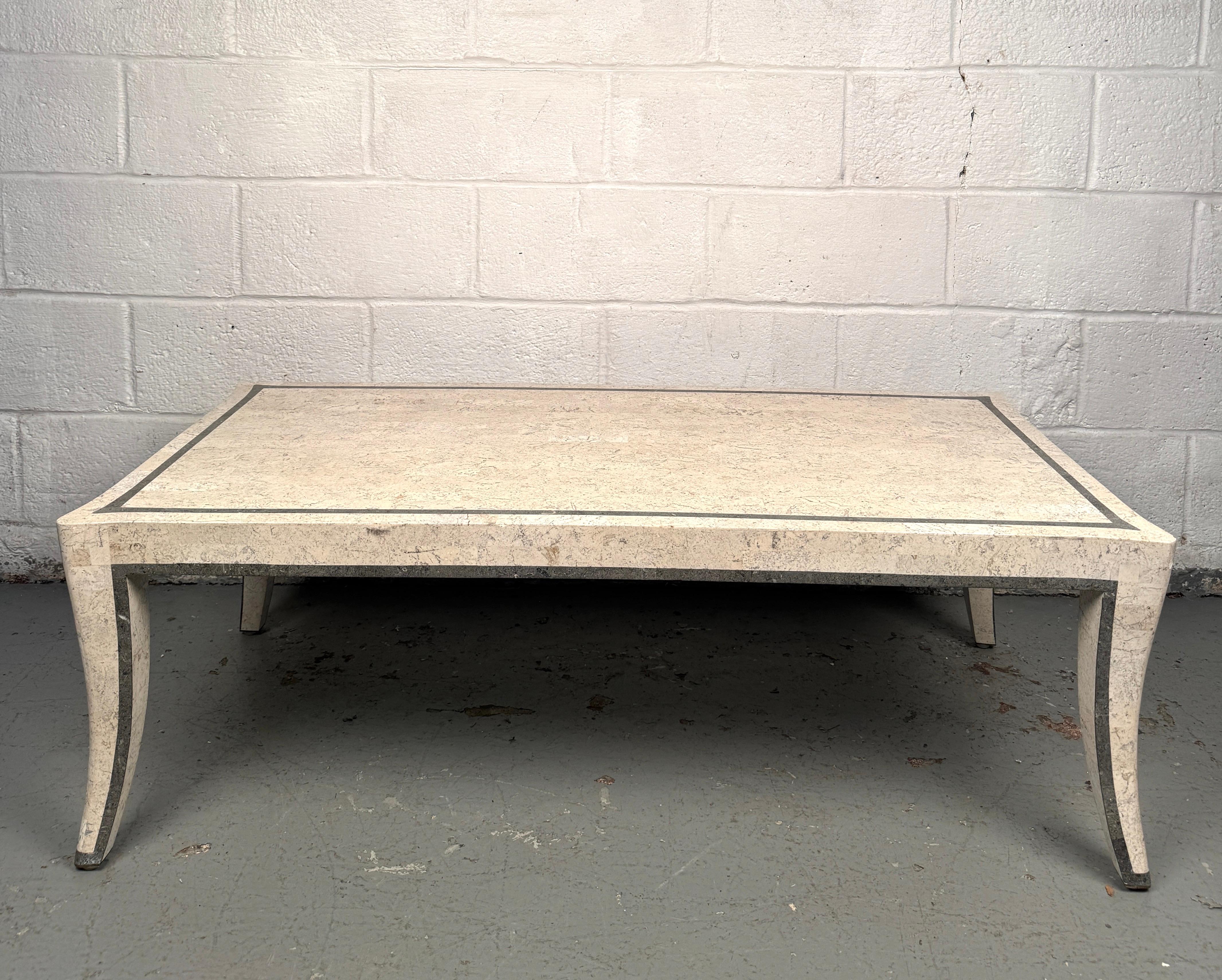 Striking mid-century coffee table clad in tessellated stone, showcasing a bold geometric surface with natural variations in tone and texture. The clean rectangular form emphasizes the craftsmanship and sculptural quality of the piece, making it both