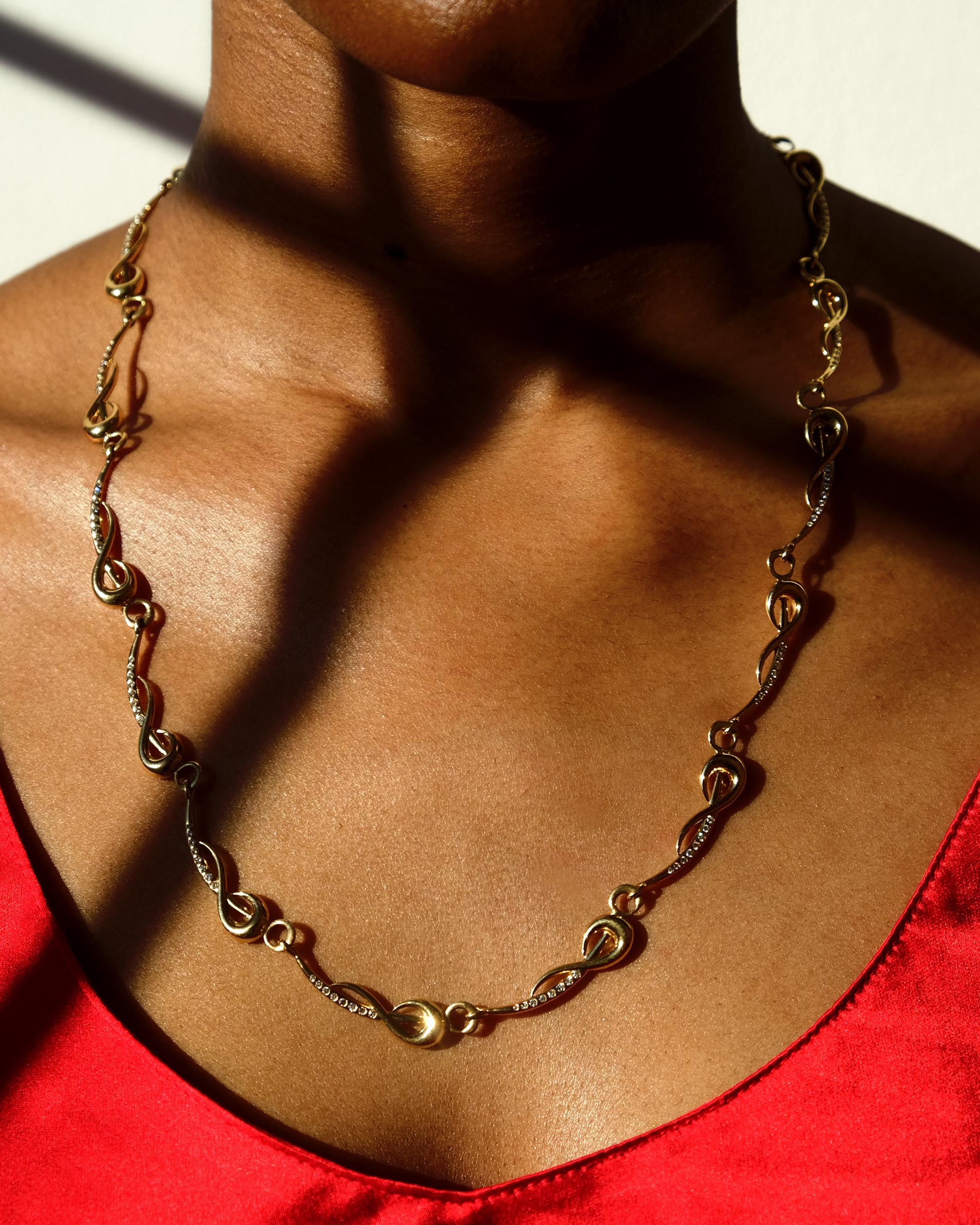 Inspired by the sword of Haitian revolutionary, Toussaint L'Ouverture. 18k gold link chain necklace set with diamonds. 
