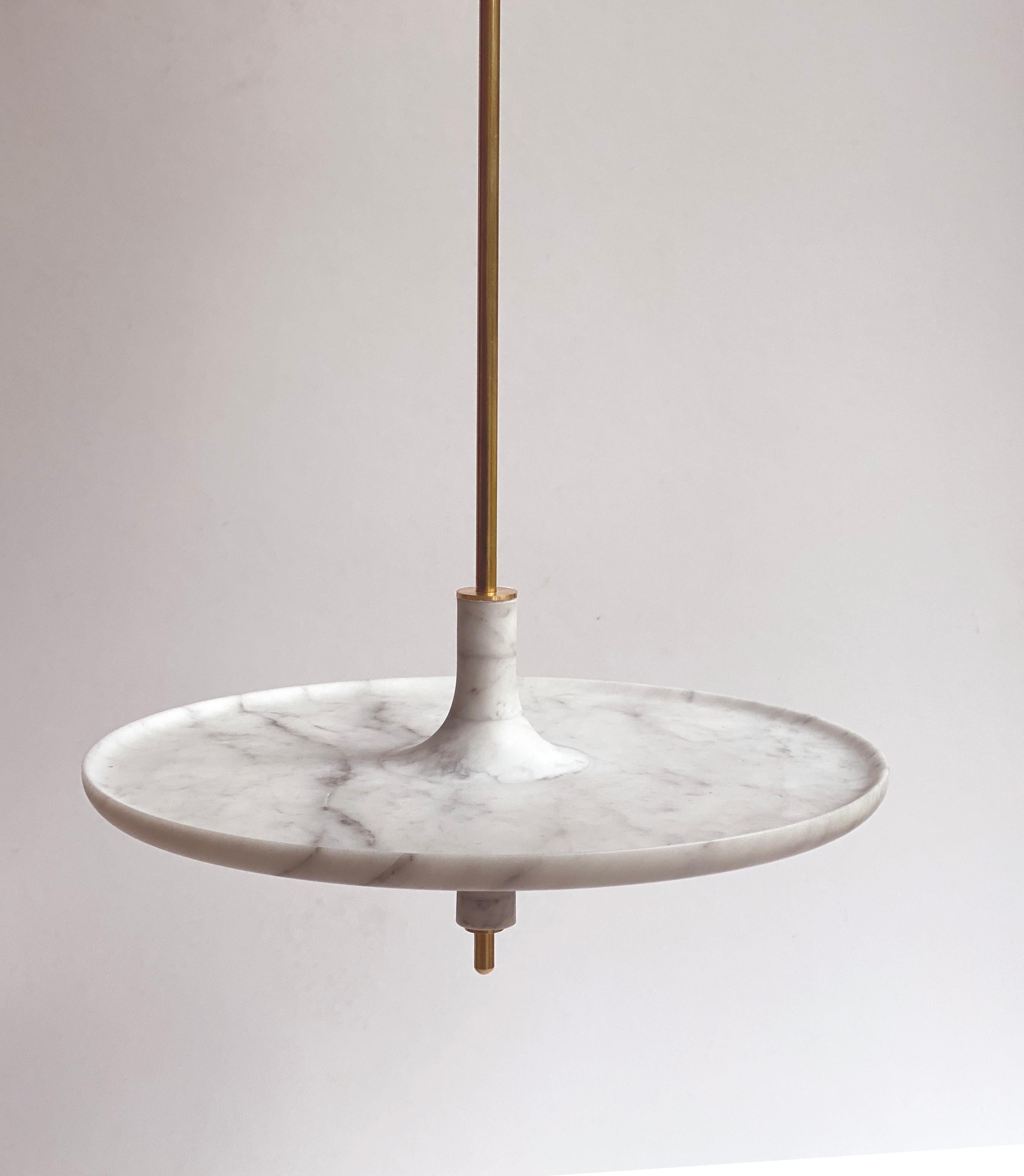 Toupy Carrara White Marble and Brass 38 Hanging Table by Mademoiselle Jo
Dimensions: Ø 38 x H 150 cm.
Materials: Carrara white marble and brass.

Available in four wood colors, three marble options, two bar versions and several diameters. Please
