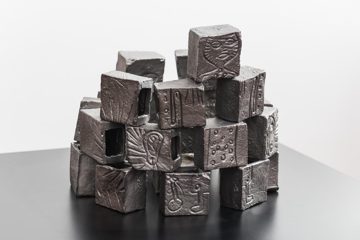 Unique incense burner in stacked blocks of cast iron with carved low relief design motifs.

Entitled “Touqous,” from the Arabic word for rituals, and designed by Faissal El-Malak. This ritualistic piece pays homage to the soap towers of Nablus,