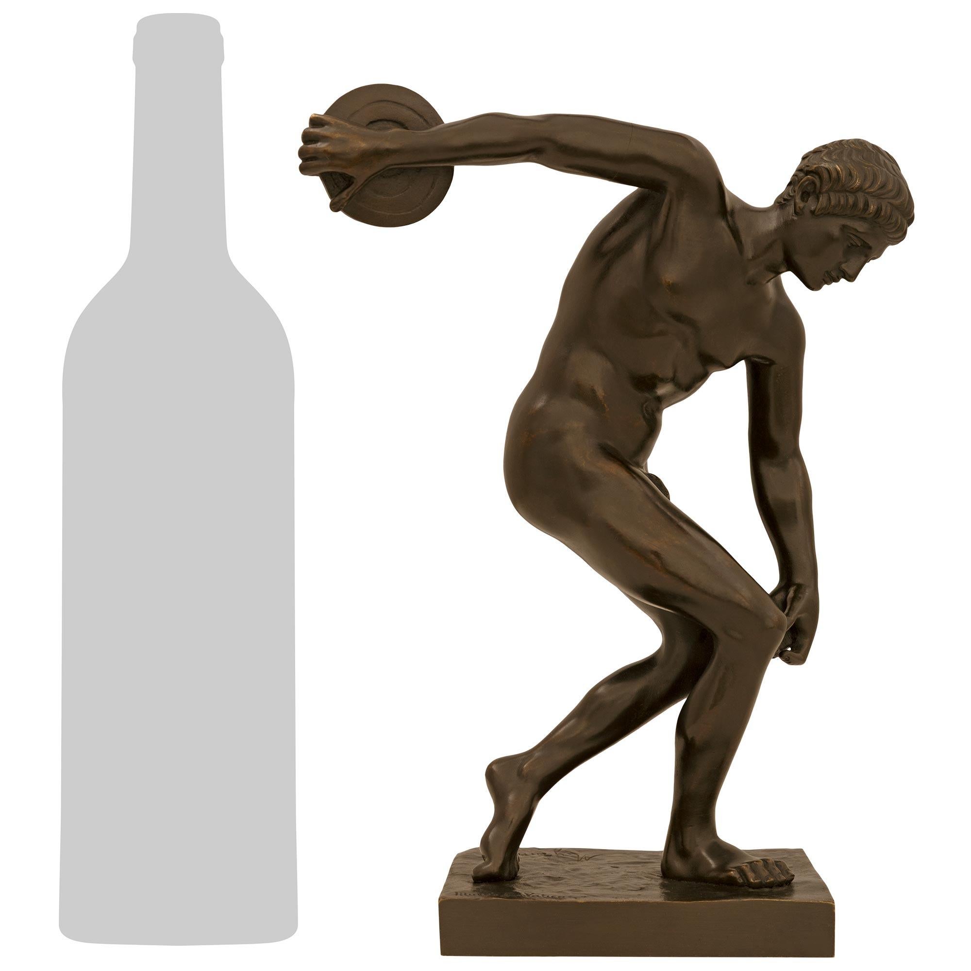 A handsome and high quality Italian 19th century Grand Tour Period patinated Bronze statue of The Discus Thrower, modeled after Myron. The impressively detailed Discobolus, which is based on Myron's statue from 460-440 BC, is raised on an elegant