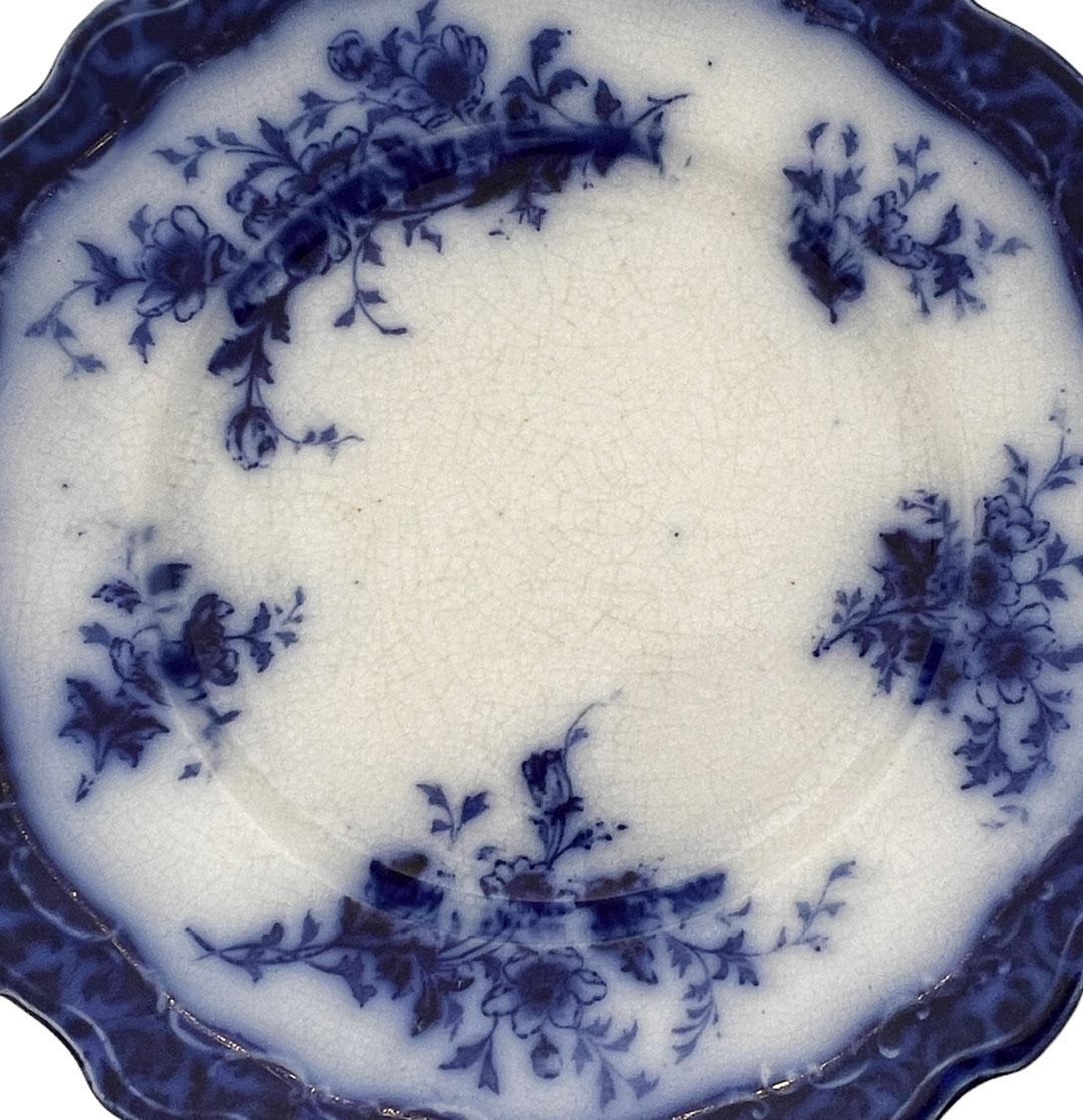 Semi porcelain flow blue plate Henry Alcott. Made in England, circa 1890s.