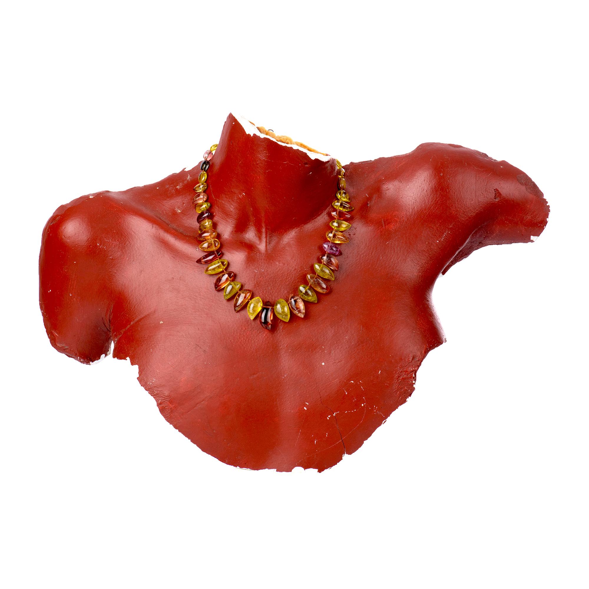 Fire and sunlight will dance around your neck when you don this stunning 18-inch necklace of paisley- and oval-shaped tourmaline beads, Colors range from lime, chartreuse and apricot to sweet shades of watermelon and rose. Clasped with Gabrielle's