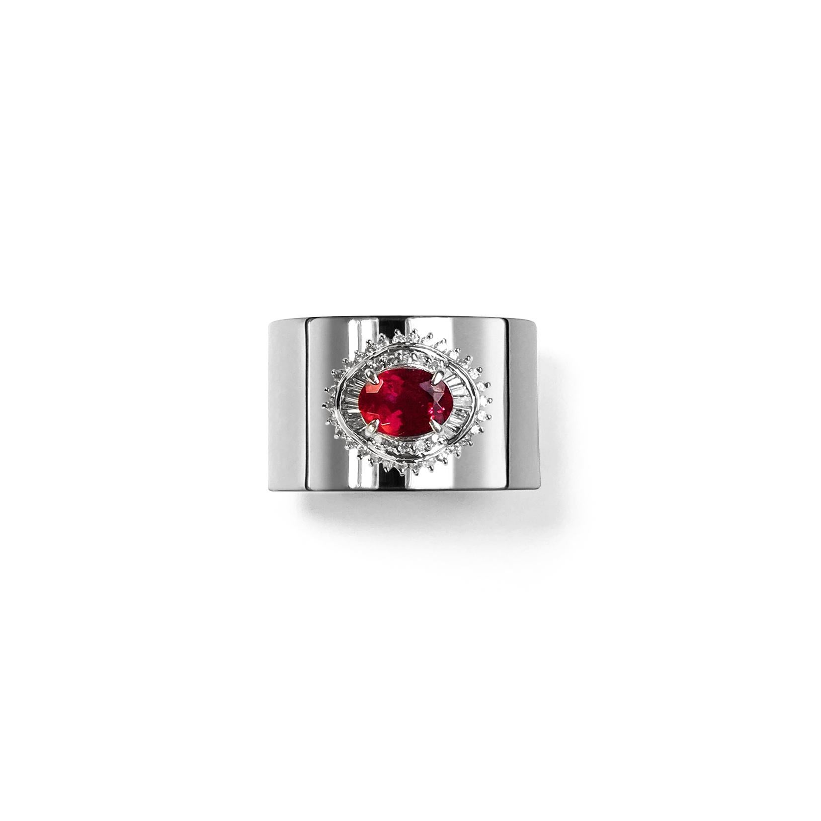 This luxurious wide-band platinum ring features deconstructed elements from repurposed vintage Tourmaline stone settings in the center. These rare and classic settings were made by highly skilled craftsmen and includes brilliant cut diamonds. This