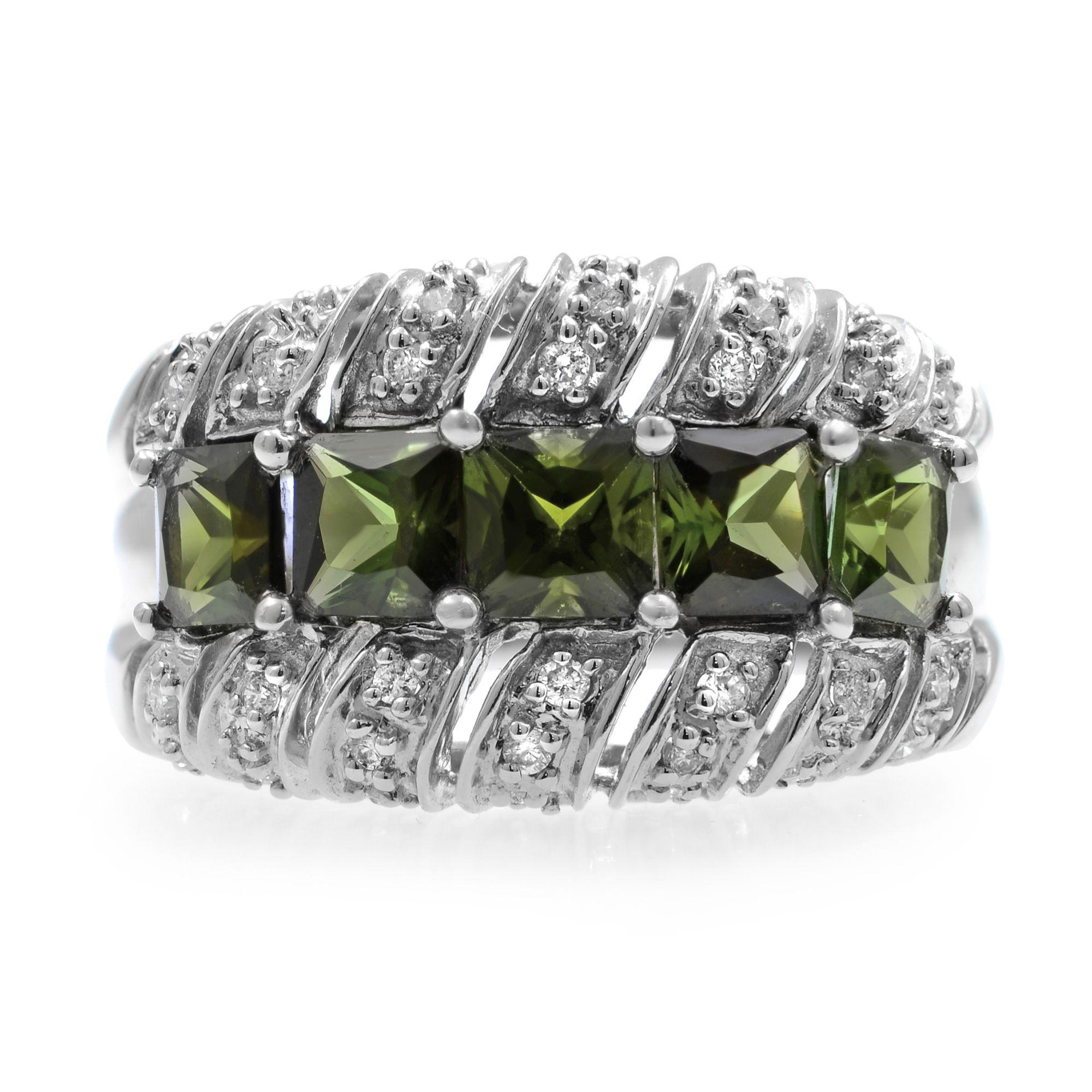 This unique Vintage ring features five beautiful green princess cut tourmalines accented by tiny round diamonds. Crafted of 14K white gold. Prong setting. The ring shines with a highly polished finish. Tourmalines total carat weight, 3.00. Diamond
