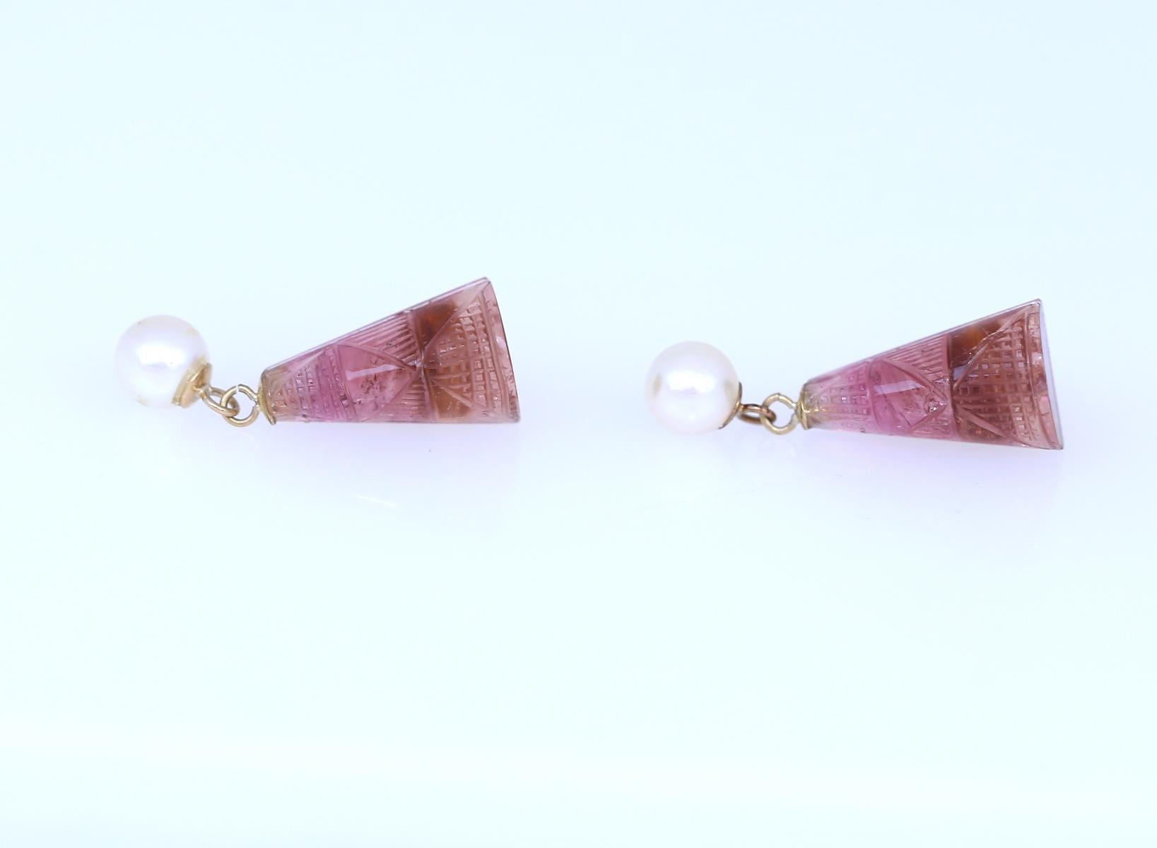 Fine engraved Tourmalines with a gradient in colour from dark orange to translucent pink. With hanging Akoya pearls. Really delicate and fine item. Very light both in design and weight, and yet it has a real presence that only true vintage items