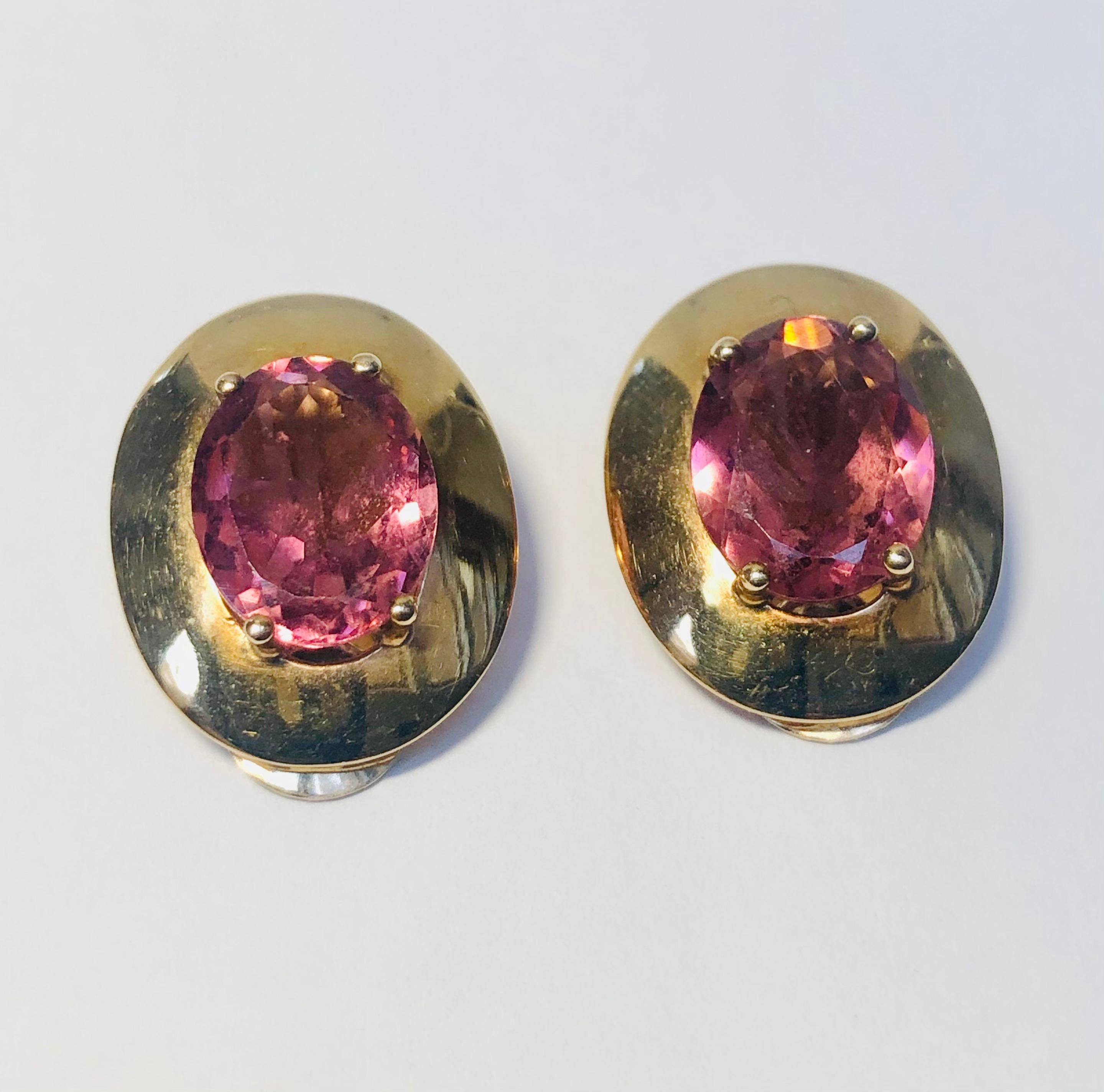 Vintage Pink Tourmaline 9kt Yellow Gold Ear Clips. Tourmaline dimensions 1.3 cm length and 1.0 cm width. Earring dimensions 1.8 cm length by 1.5 cm width and 1.0 cm depth. Ear clip fastening. The tourmaline gem stones are oval and mixed cut.