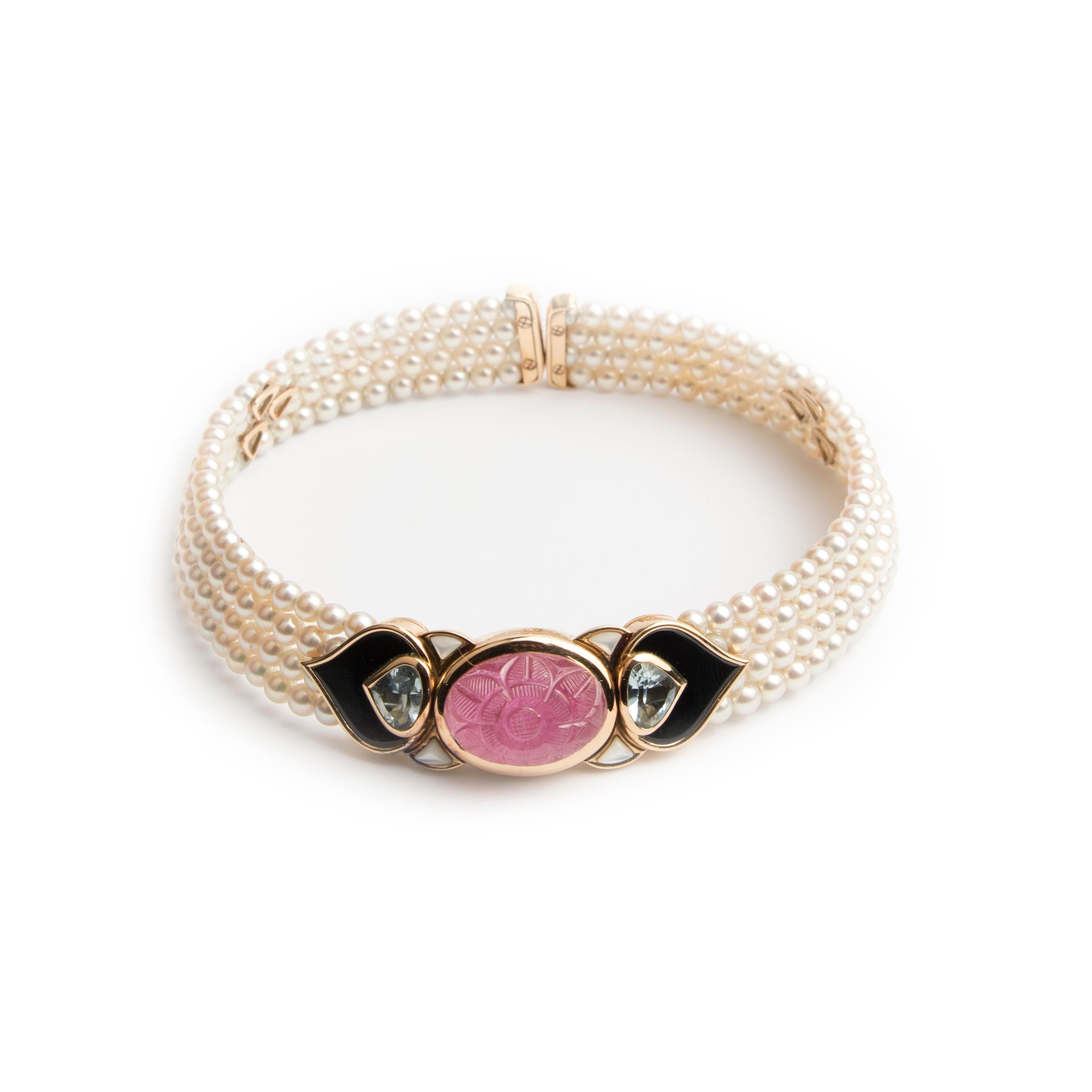 Marina B choker necklace 'Pauline', made of four strands of cultured pearls (4-4.5 mm) on springs, centred by a 18k yellow gold motive, set with an oval pink tourmaline engraved with floral decor, mother of pearl, onyx and aquamarine. 
Signed Marina