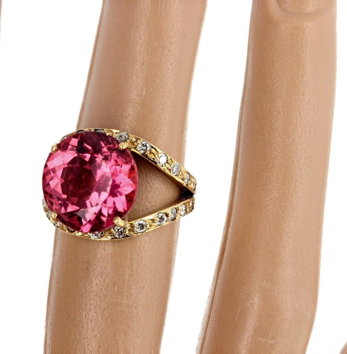 Unique Brilliant glittering natural pink 12.7 mm round Tourmaline (8.36 carats) enhanced with approximately one carat of sparkling white diamonds set in a handmade 18Kt yellow gold ring size 6 (sizable for free).  There are NO eye visible inclusions