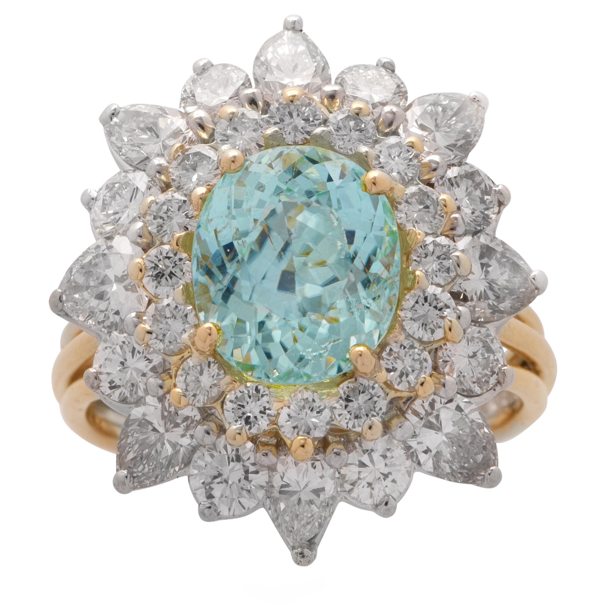 Elegant ballerina ring crafted in 18 karat white and yellow gold, featuring a GIA certified rich greenish-blue oval cut Tourmaline weighing 2.72 carats, surrounded by 32 round brilliant cut and pear shape diamonds, weighing approximately 3 carats,
