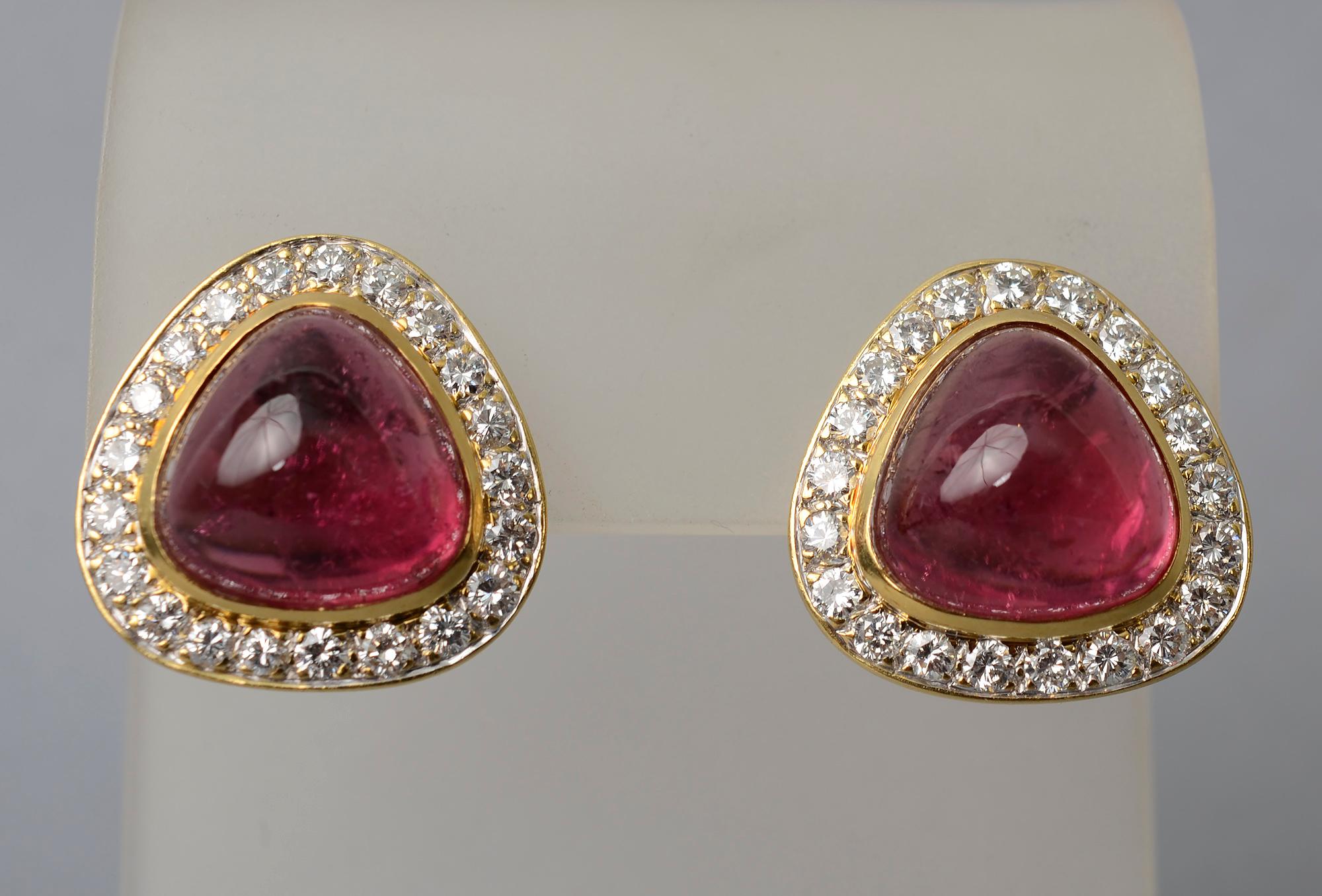 Triangle shaped tourmaline earrings surrounded by diamonds. The 18 karat gold earrings have approximately 2 carats of VS diamonds. The earrings are 3/4