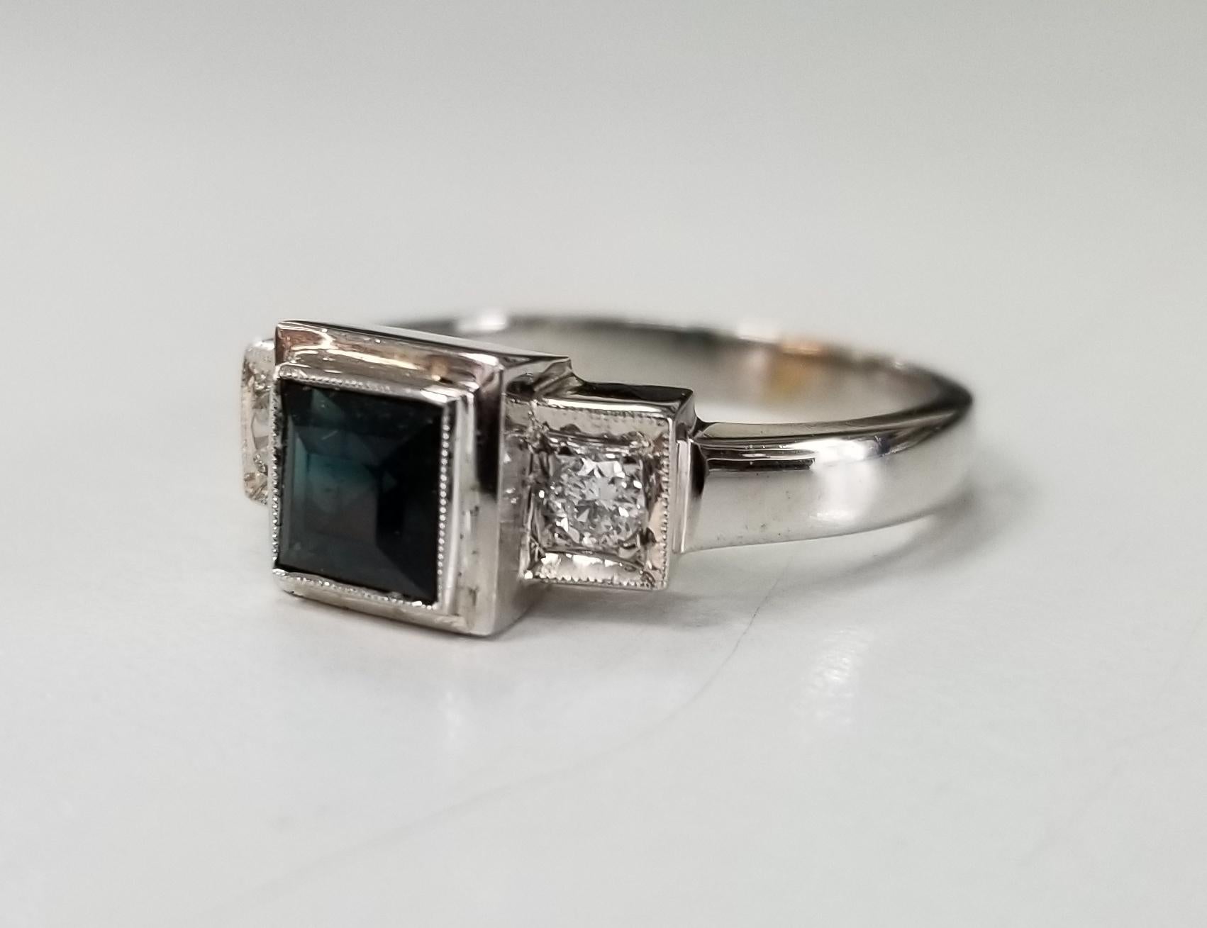 14k white gold Tourmaline and diamond ring, containing 1 square cut tourmaline weighing .68pts. and 2 round full cut diamonds of very fine quality weighing .14pts.  This ring is a size 7 but we will size to fit for free.