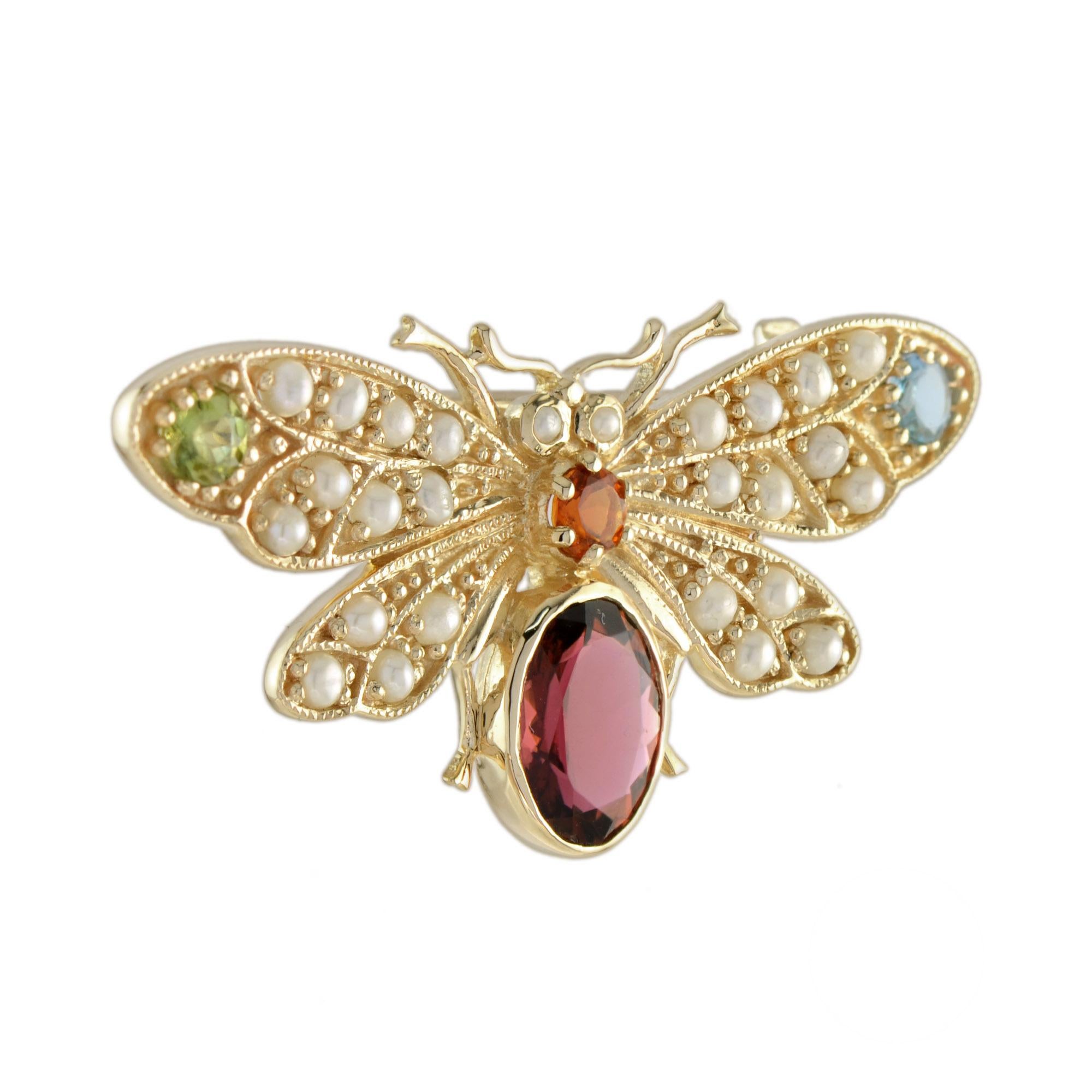 A stunning bee brooch was inspired by Victorian period insect broch. In abdomen is adorned with vivid pink tourmaline. The wings and middle body are decorated with green, red, and blue tourmaline.  The brooch can also be worn as a pendant. Bee is a