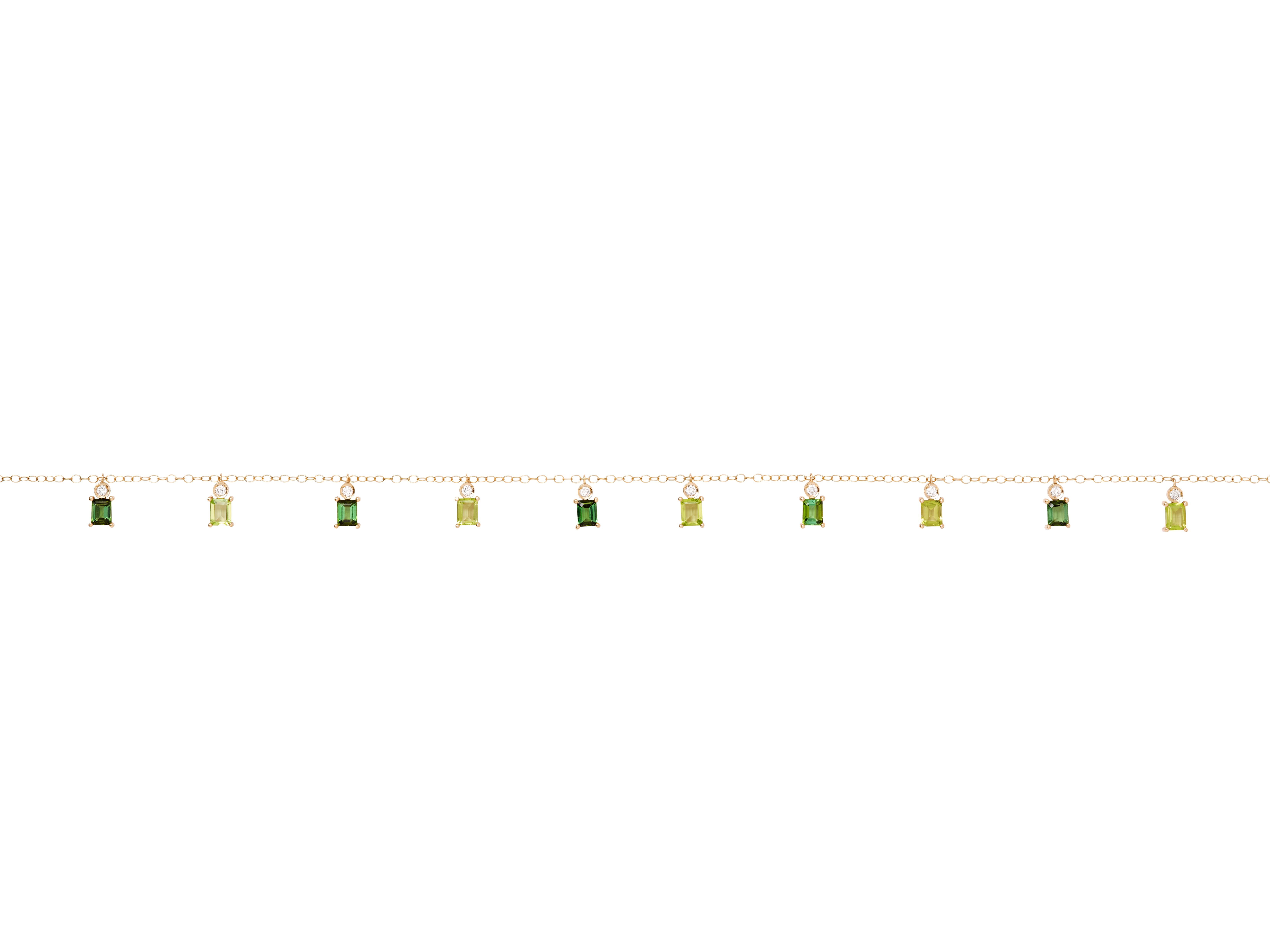 This beautifully delicate 18k yellow gold necklace featuring ten semi-precious Tourmaline, Peridot and Diamond charms that can be worn alone, or layered with other necklaces to create a playful and effortlessly stylish look. Can be worn at multiple