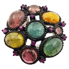 Anillo de turmalina y zafiro rosa engastado en plata
