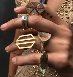 Anello ottagonale con tormalina baguette e solitario in oro giallo 18 ct.