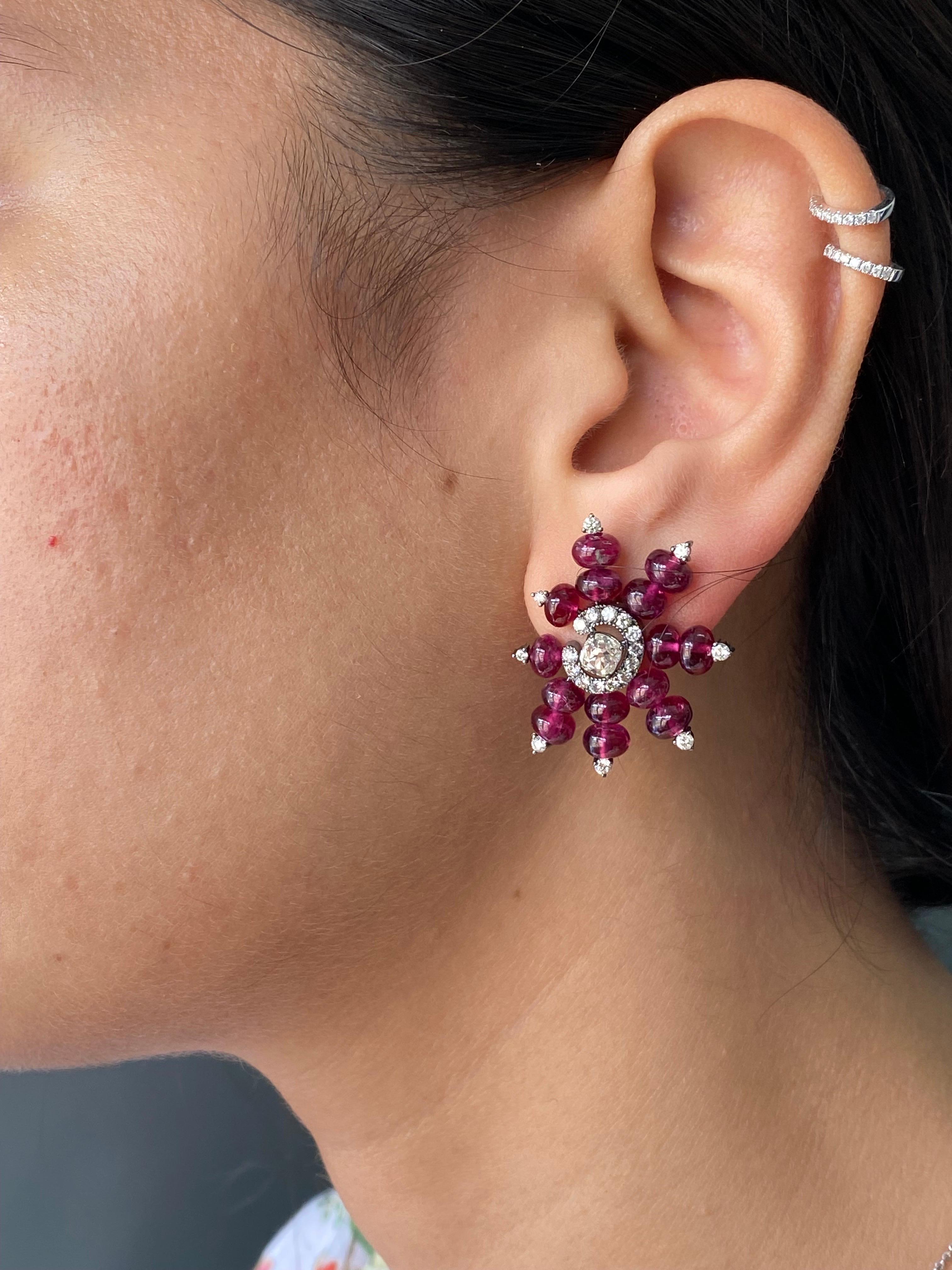 A modern looking 23.93 carat tourmaline and 1.99 carats diamond studs, with the center diamond stone weighing 0.84 in total. The earrings are made in solid 18K gold, black rhodium polish - giving it a very unique look. Comes with a push pull