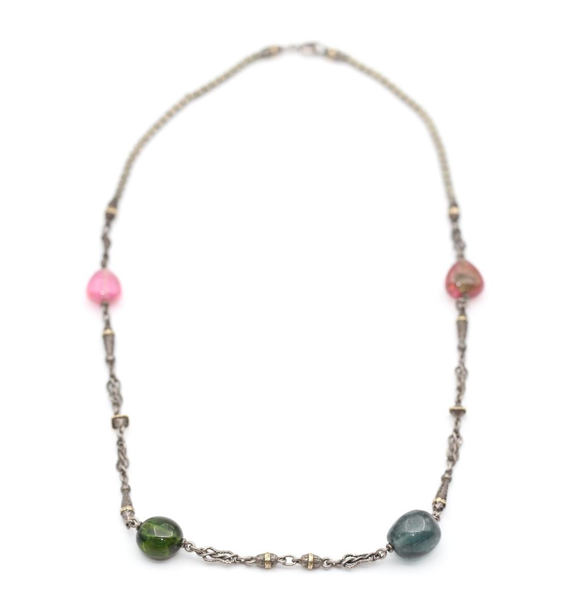 Tourmaline Beads Silver and Gold Necklace, 1960 
Tourmaline Beads Silver and Gold Necklace. 
Created around 1960.
Simple and fine item yet the quality of the jeweler's work is outstanding. There are so many details in the links and beads. 

The