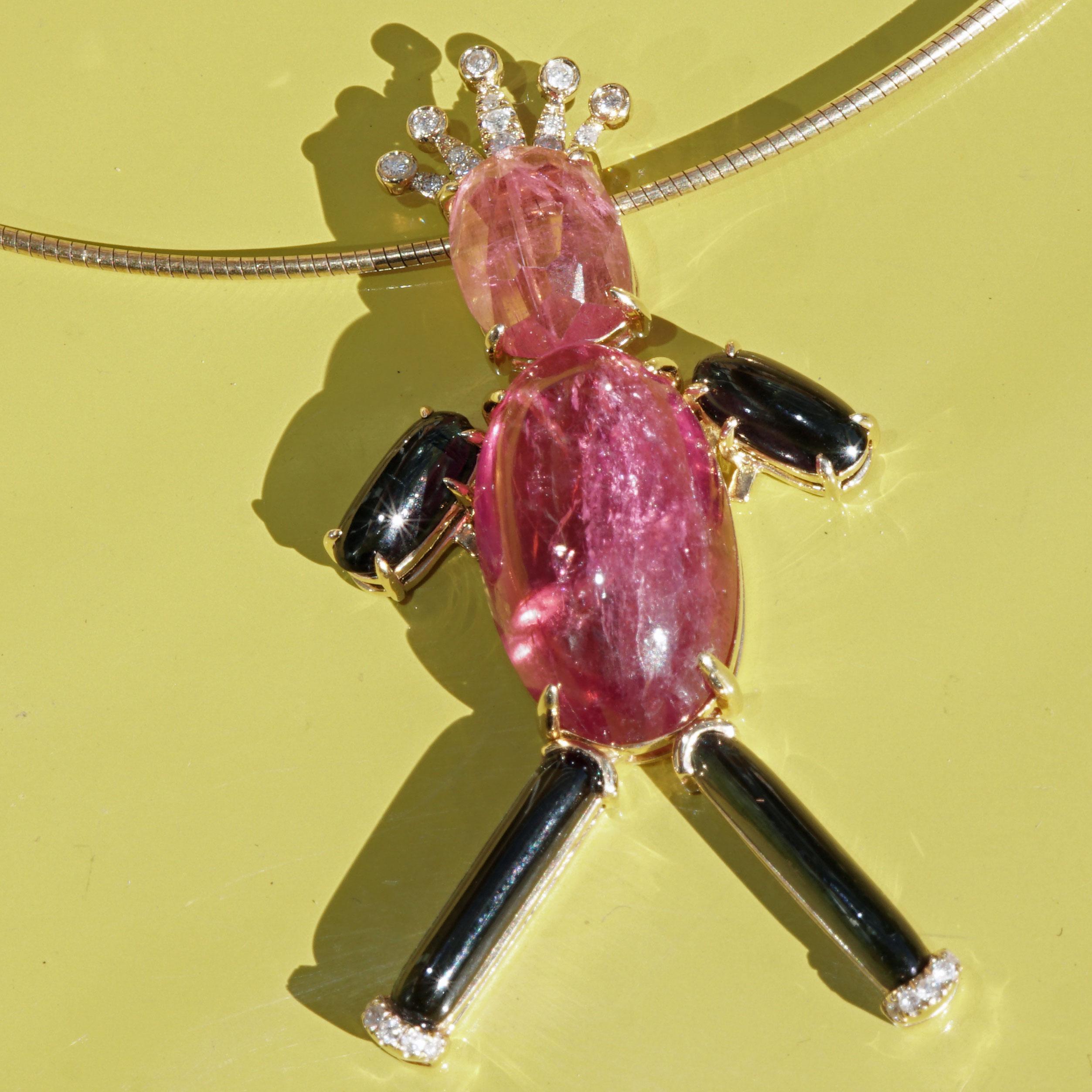 sometimes funny motifs arise from gemstones here it had to be our gemstone prince, 18 kt yellow gold pendent consisting of tourmalines in the colors pink and green, total 20.82 ct, cabochon cut or rose cut, translucent set with crabs, very good to