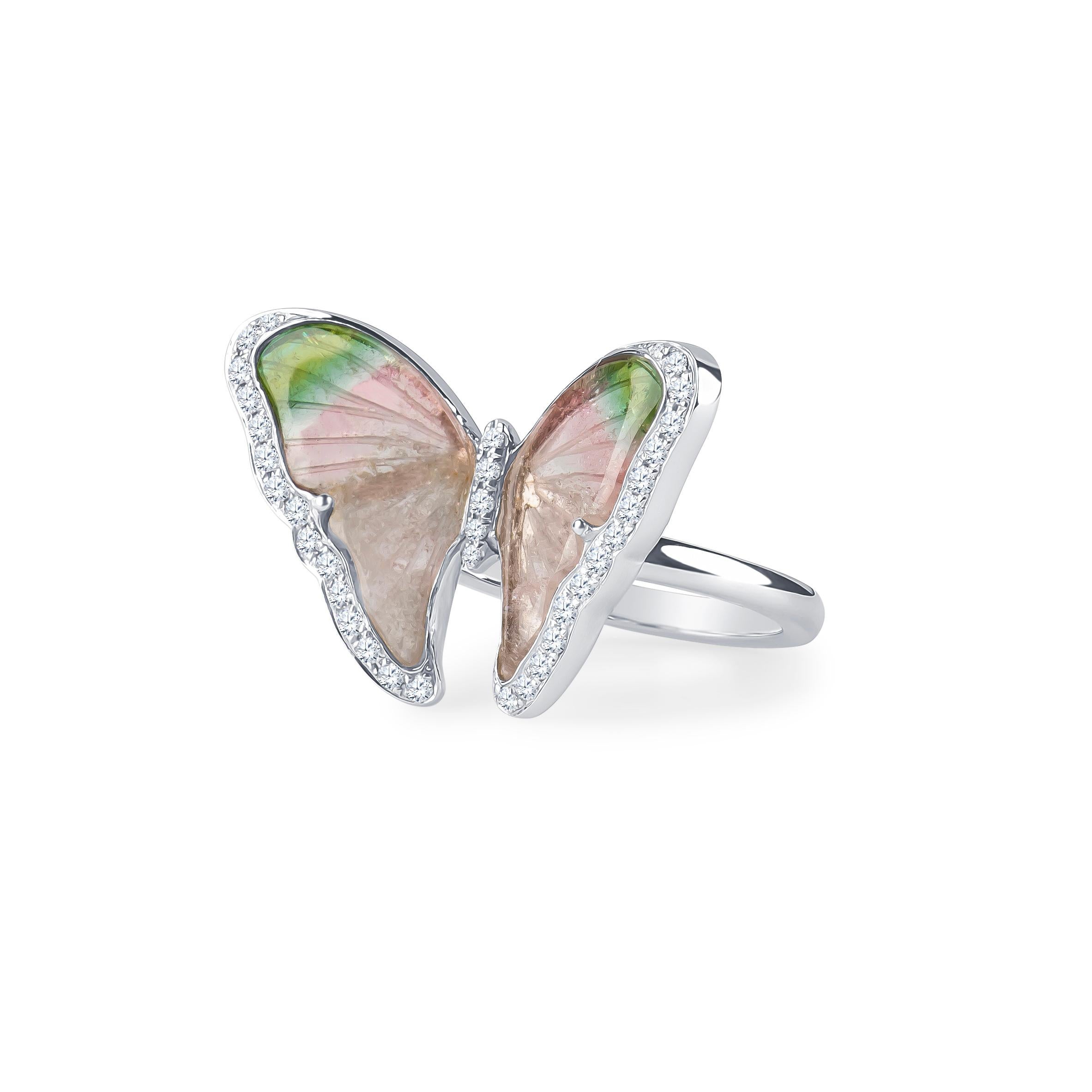 Natural tourmaline butterfly ring with 0.25 carat total weight in round brilliant cut natural diamond accents set in 18K white gold. Size 6 & may be resized to larger or smaller upon request. 