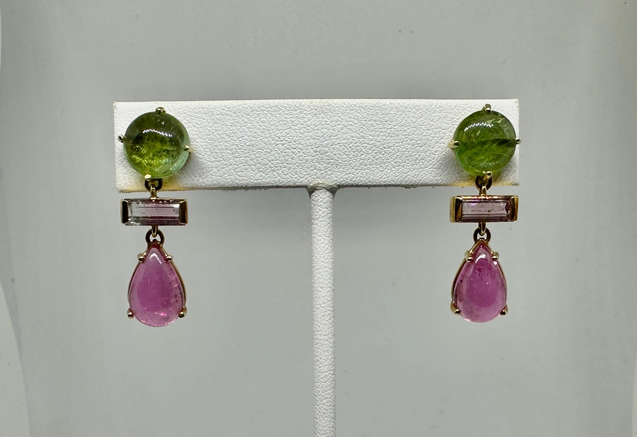 Indulge in a stunning pair of Multicolored Tourmaline Pendant Dangle Drop Earrings in 14 Karat Gold.    The antique earrings have round cabochon green tourmalines, rectangular-cut bicolor 'watermelon' tourmalines and drop-shaped cabochon pink