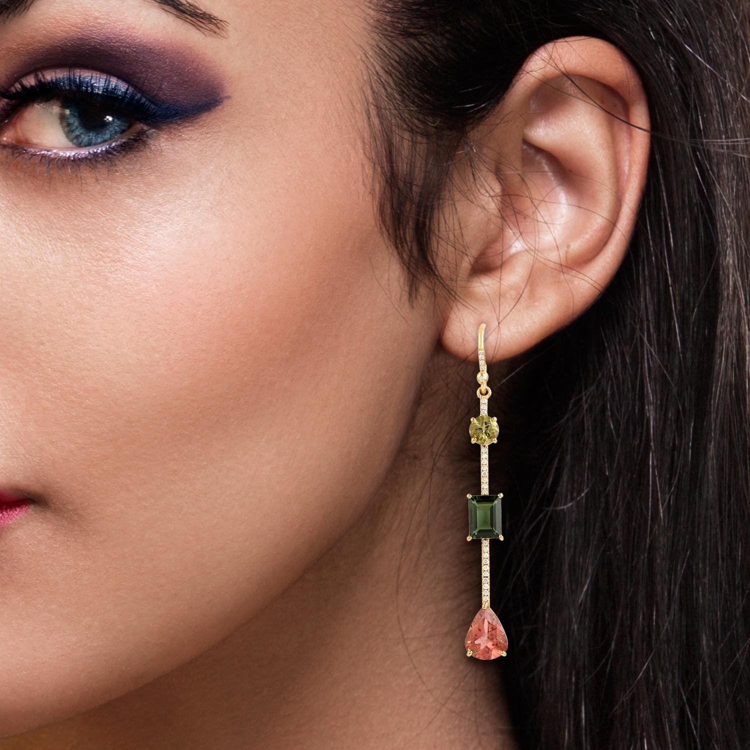 These beautiful linear drop earring are handcrafted in 18-karat gold. It is set with 9.28 carats tourmaline and .29 carats of glimmering diamonds.

FOLLOW  MEGHNA JEWELS storefront to view the latest collection & exclusive pieces.  Meghna Jewels is