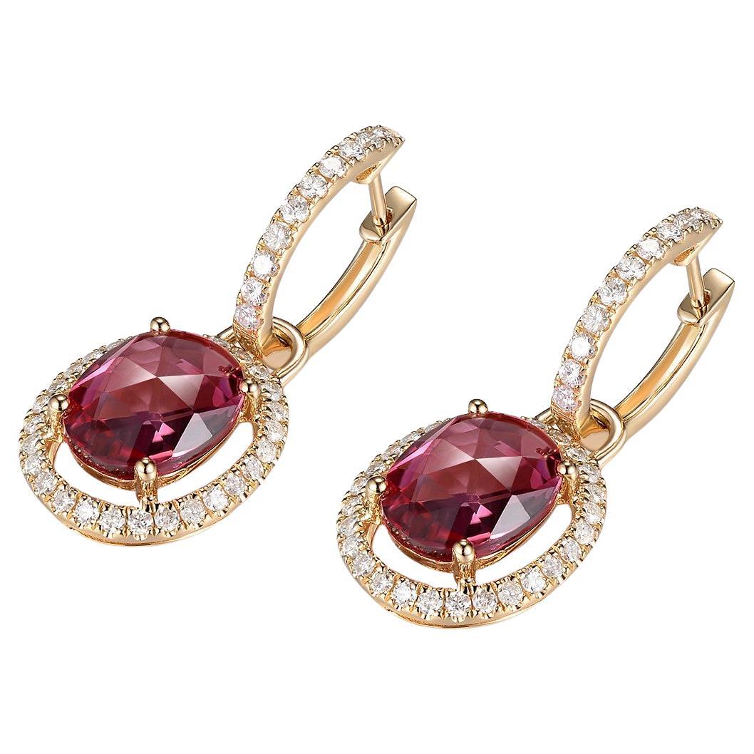 These stunning earrings showcase the captivating beauty of oval tourmaline gemstones and the timeless elegance of diamond halos. Crafted in 14 karat gold, these earrings are a perfect combination of sophistication and versatility.

The earrings