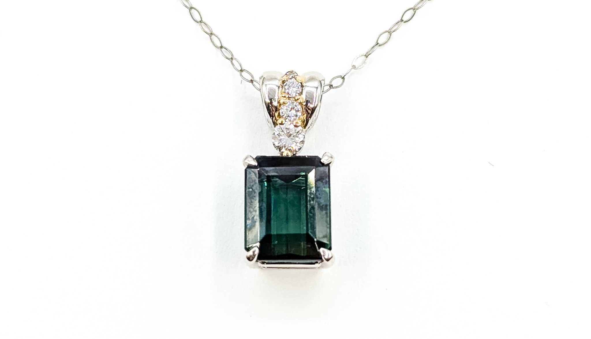Tourmaline & Diamond Drop Pendant in 18k White Gold

This pendant is crafted in 18k white gold and features prong-set green tourmaline, with a drop design. The tourmaline weighs 3.59ct. The round diamonds total 0.17ctw, near colorless with SI