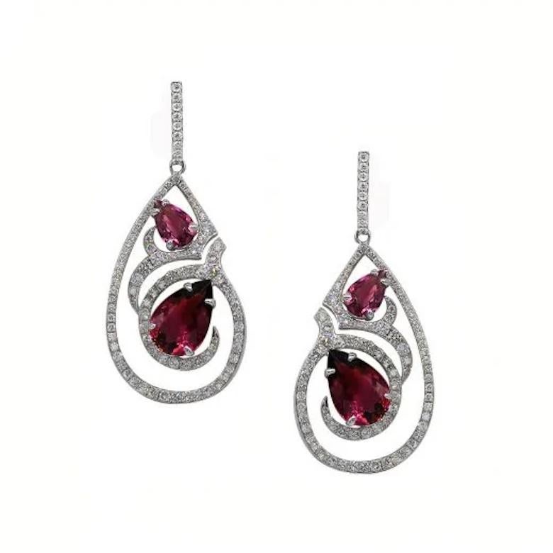 Earrings White 14K Gold (Matching Pendant Available)

Diamond 132-RND57-0,67-3/5A 
Diamond 2-RND57-0,004-3/5A 
Diamond 22-RND57-0,34-3/5A 
Tourmaline  4-1,94 ct
Weight 5,08 grams 

It is our honour to create fine jewelry, and it’s for that reason
