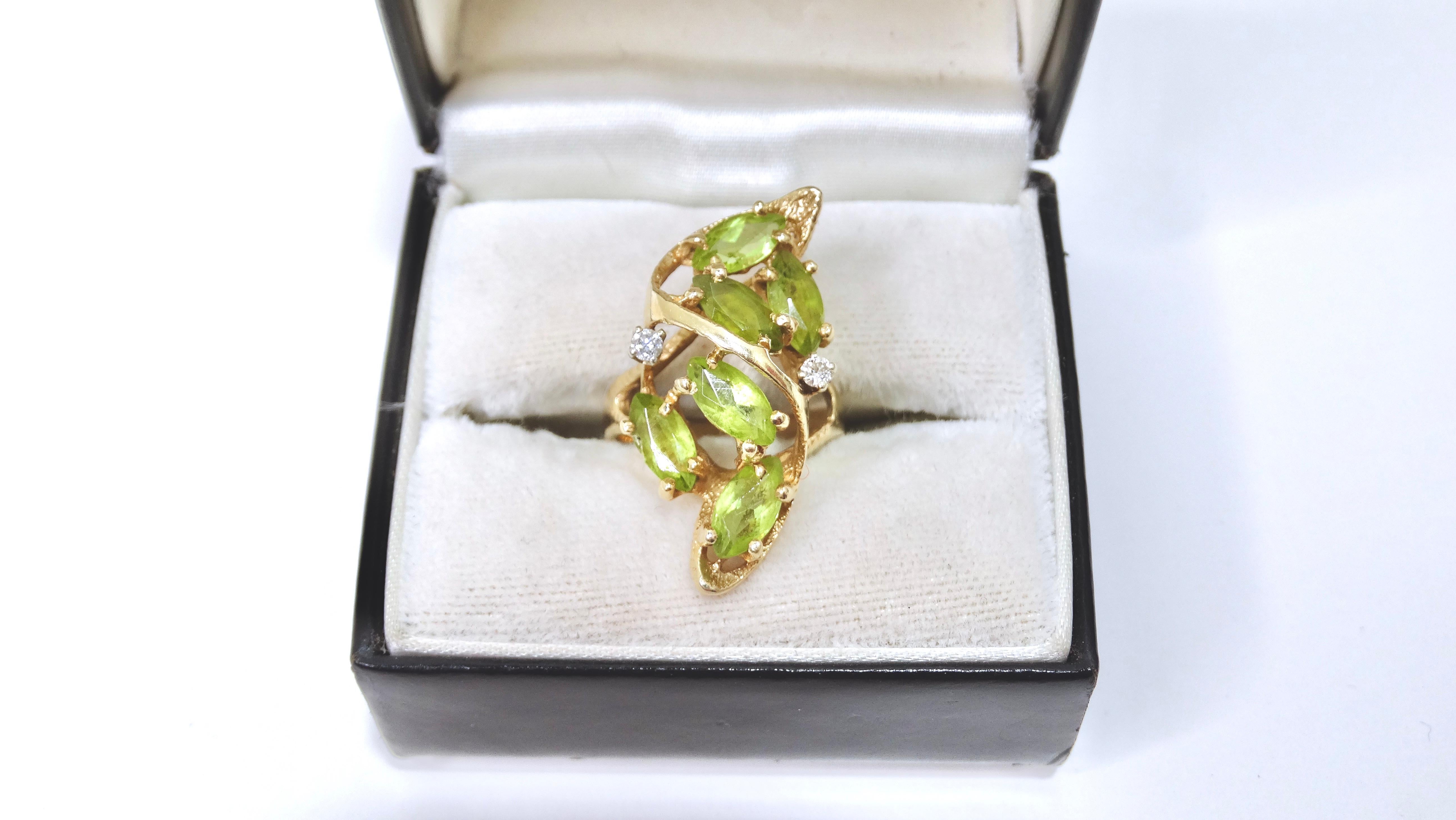 A beautiful piece to add to your ring collection! This is a large cocktail ring that has a radiant collection of stones. It includes six tourmaline stones accompanied by two diamonds. This ring will add a pop of color to bring any outfit to life.