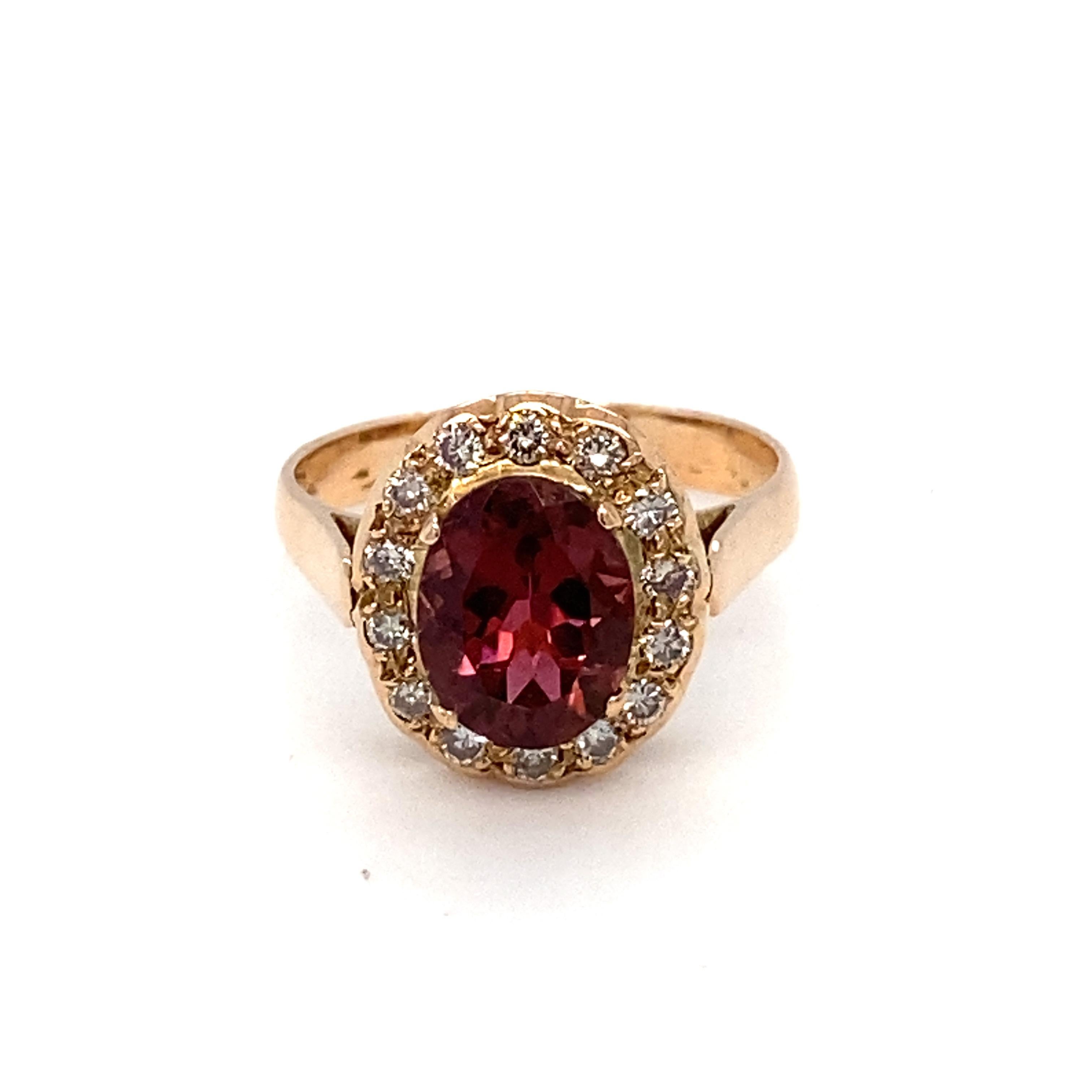 This halo ring has pink purple tourmaline as center stone surrounded with a halo of white diamonds in pave setting. Set in 14K yellow gold and is crafted with hand. Birthstone for the month of October it is perfect for everyday wear. Size is 6