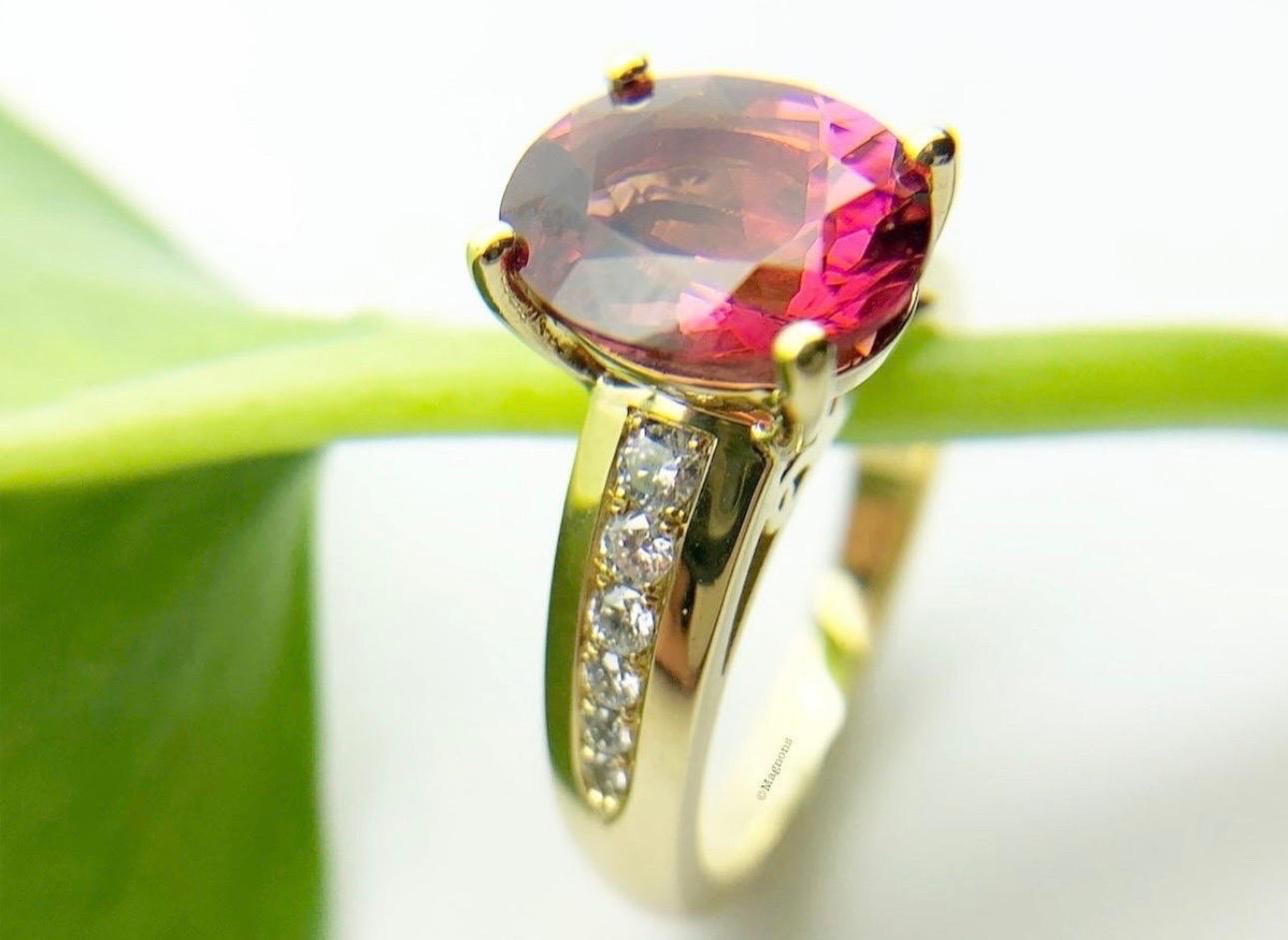 3ct Tourmaline deep pink color in a gorgeous royal 18KT yellow gold made with natural diamonds VS clarity, F color. The ring is size 7 and can be re-sized.

Company policy every item has to have a certificate of authenticity before it leaves our
