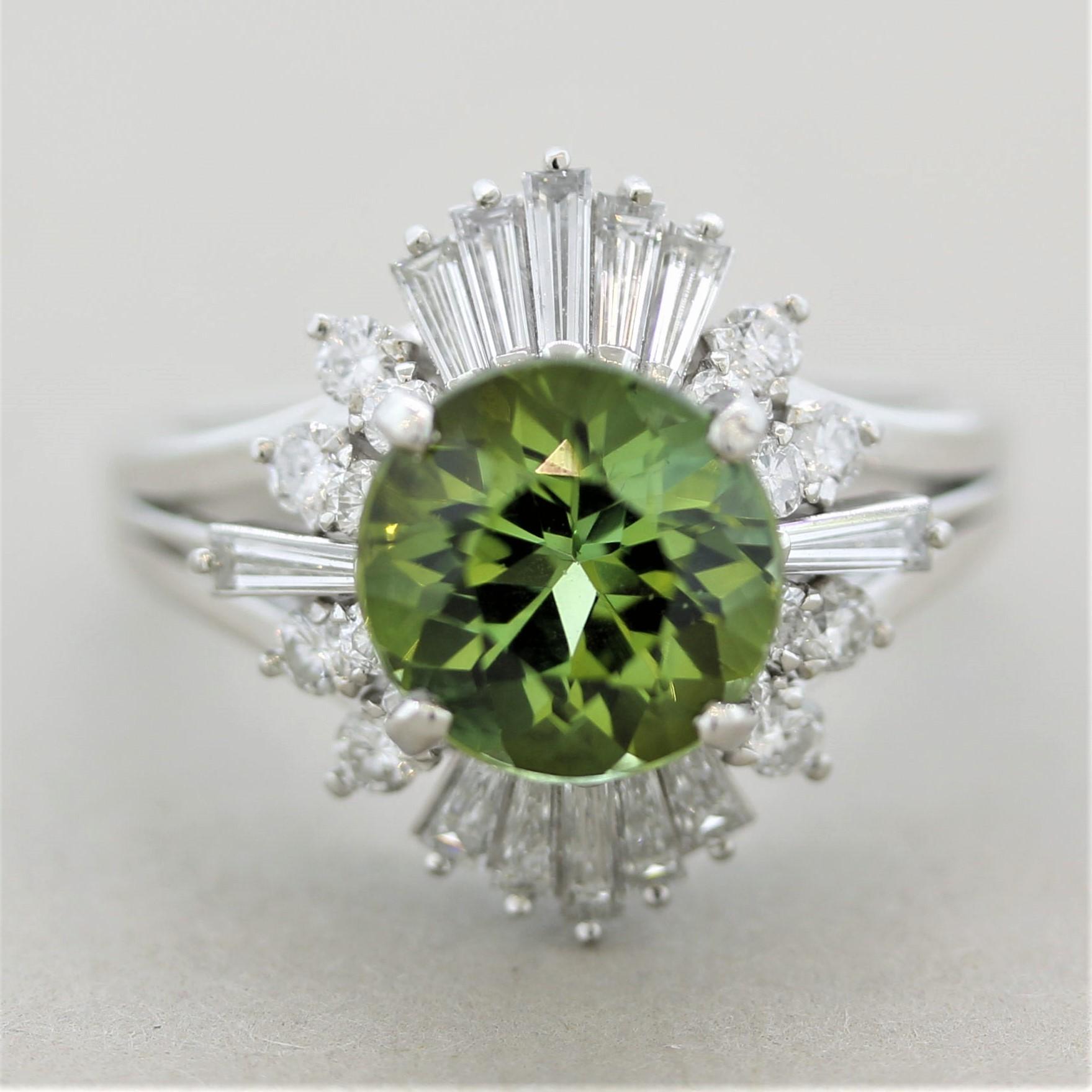 A sweet and stylish tourmaline and diamond ring! The tourmaline weighs 2.57 carats and has a bright lively lime green color with excellent brilliance. It is accented by 0.95 carats of round brilliant-cut and baguette-cut diamonds set around the