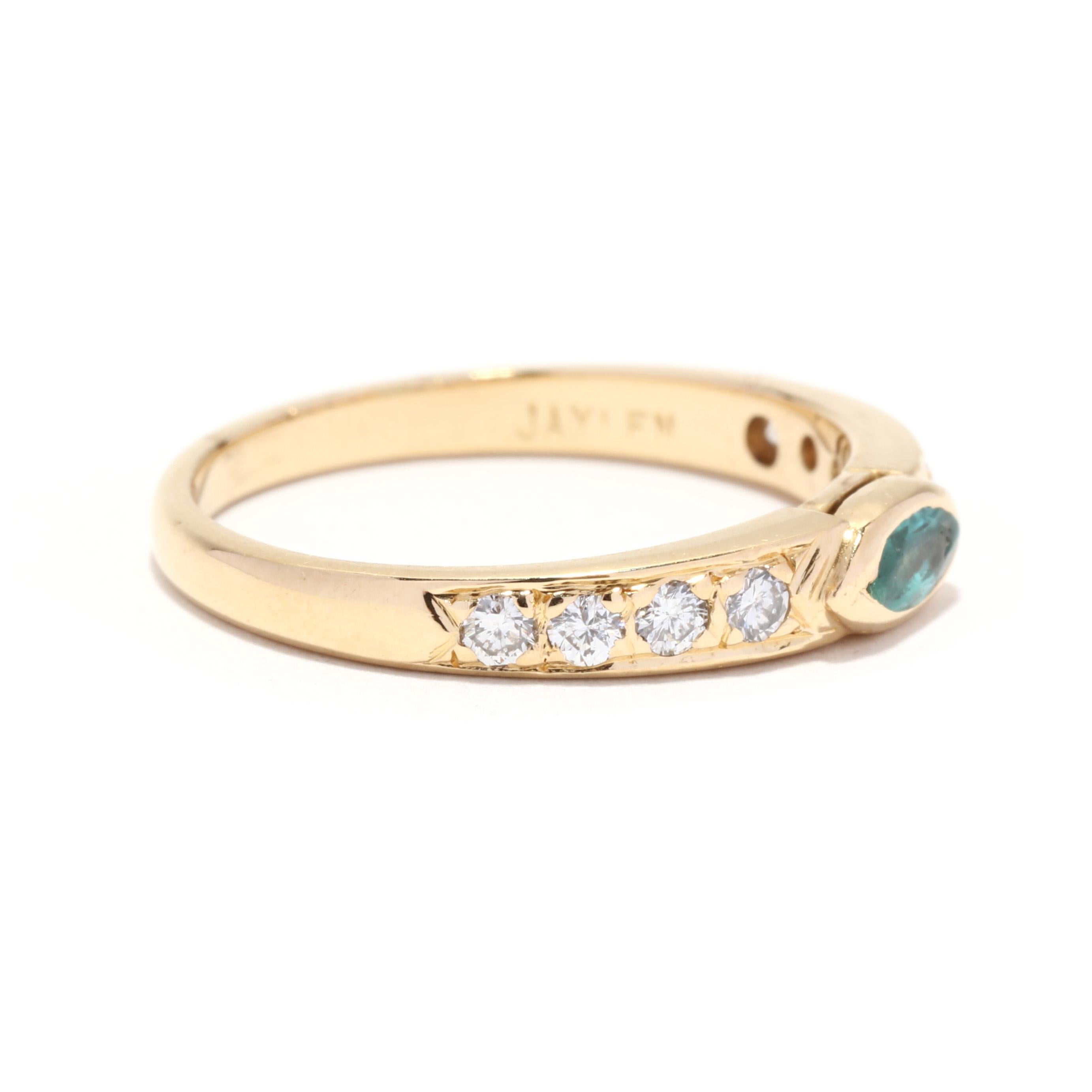 An 18 karat yellow gold tourmaline and diamond stackable band ring. This vintage ring features a horizontal bezel set, marquise cut blueish green tourmaline weighing approximately .15 carat with a tapered band accented with round brilliant cut