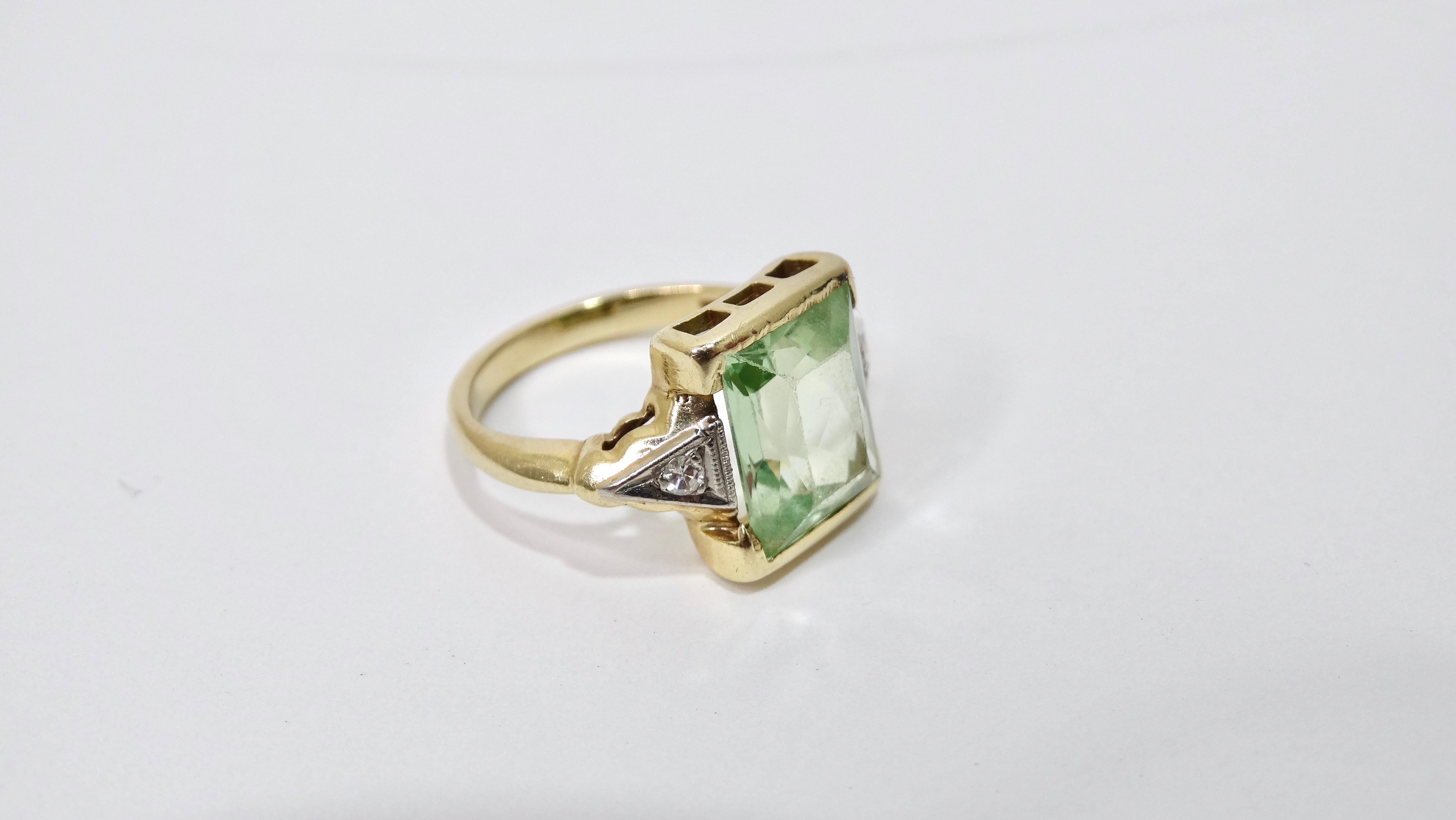 A wondrous and stunning ring that will bring to life your jewelry collection! This ring is made of a vibrant 14k gold complimented by a large tourmaline emerald cut stone in the center accompanied by two diamonds on either side. Don't miss the great