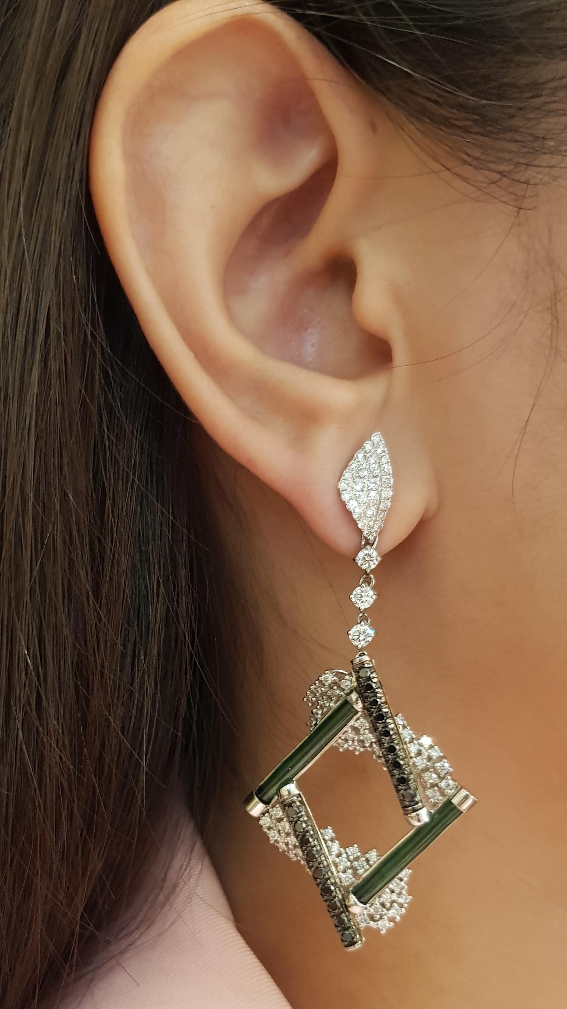 Tourmaline 4,15 carats, diamant 1,97 carat et diamant brun 0,65 carat Boucles d'oreilles serties dans une monture en or blanc 18 carats

Largeur :  2.7 cm 
Longueur :  6.0 cm
Poids total : 20,22 grammes

