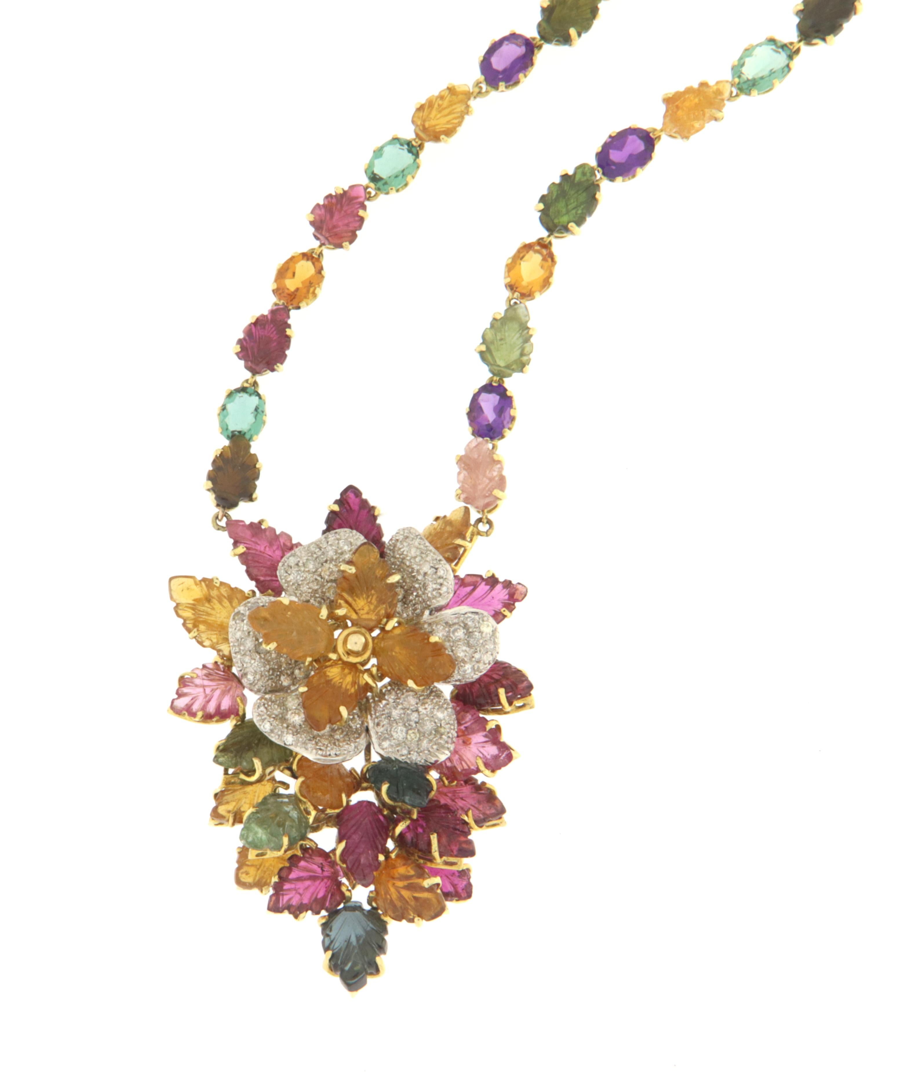 Necklace Explosion of color mounted in yellow and white gold 14 karat, diamonds and mix colour leaves tourmalines.
Necklace to wear also for important events

Tourmaline total weight 50.28 Karat
Diamonds weight 2.90 karat
Necklace total weight 55.40