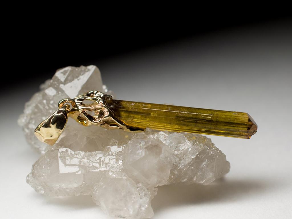 14K yellow gold pendant with natural brown Tourmaline Dravite crystal
tourmaline measures - 0.16 х 1.18 in / 4 х 30 mm
stone weight - 6.85 carats
pendant weight - 2.82 grams
pendant height - 1.69 in / 43 mm

We ship our jewelry worldwide – for our