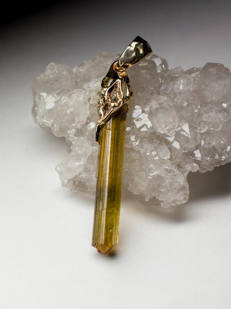 14K yellow gold pendant with natural brown Tourmaline Dravite crystal
tourmaline measures - 0.16 х 1.18 in / 4 х 30 mm
stone weight - 6.85 carats
pendant weight - 2.82 grams
pendant height - 1.69 in / 43 mm

Roots collection


We ship our jewelry