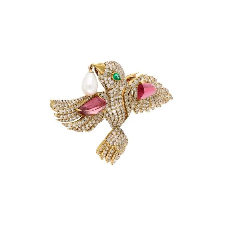 A stunning brooch cast in 18 karat gold.  It is hand set 3.84 carats tourmaline, .15 carats emerald, 2.45 carats pearl and 4.13 carats of sparkling diamonds.

FOLLOW MEGHNA JEWELS storefront to view the latest collection & exclusive pieces.  Meghna