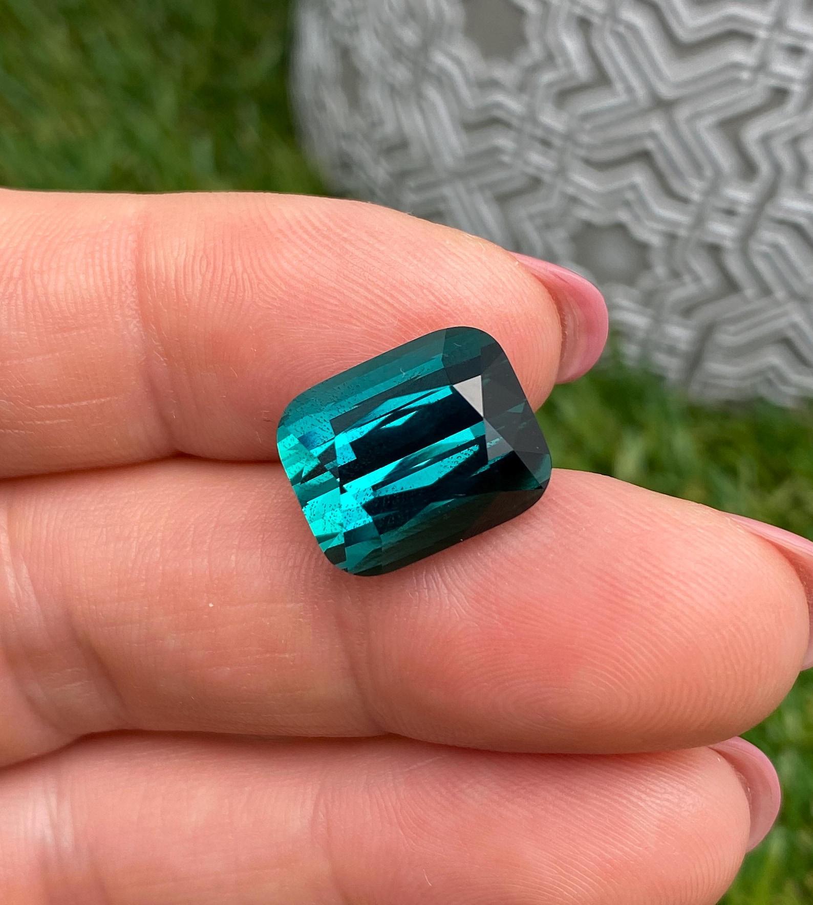 Natural Lagoon Tourmaline Loose gemstone from Afghanistan!

Certificate GFCO and GIA
Gemstone Color: blue-green
Gemstone Type: Tourmaline
Gemstone size: 14.26x11.64x9.21mm
Cut Grade: Very Good
Clarity/Grade: VVS
Gemstone Shape: Cushion cut
Gemstone