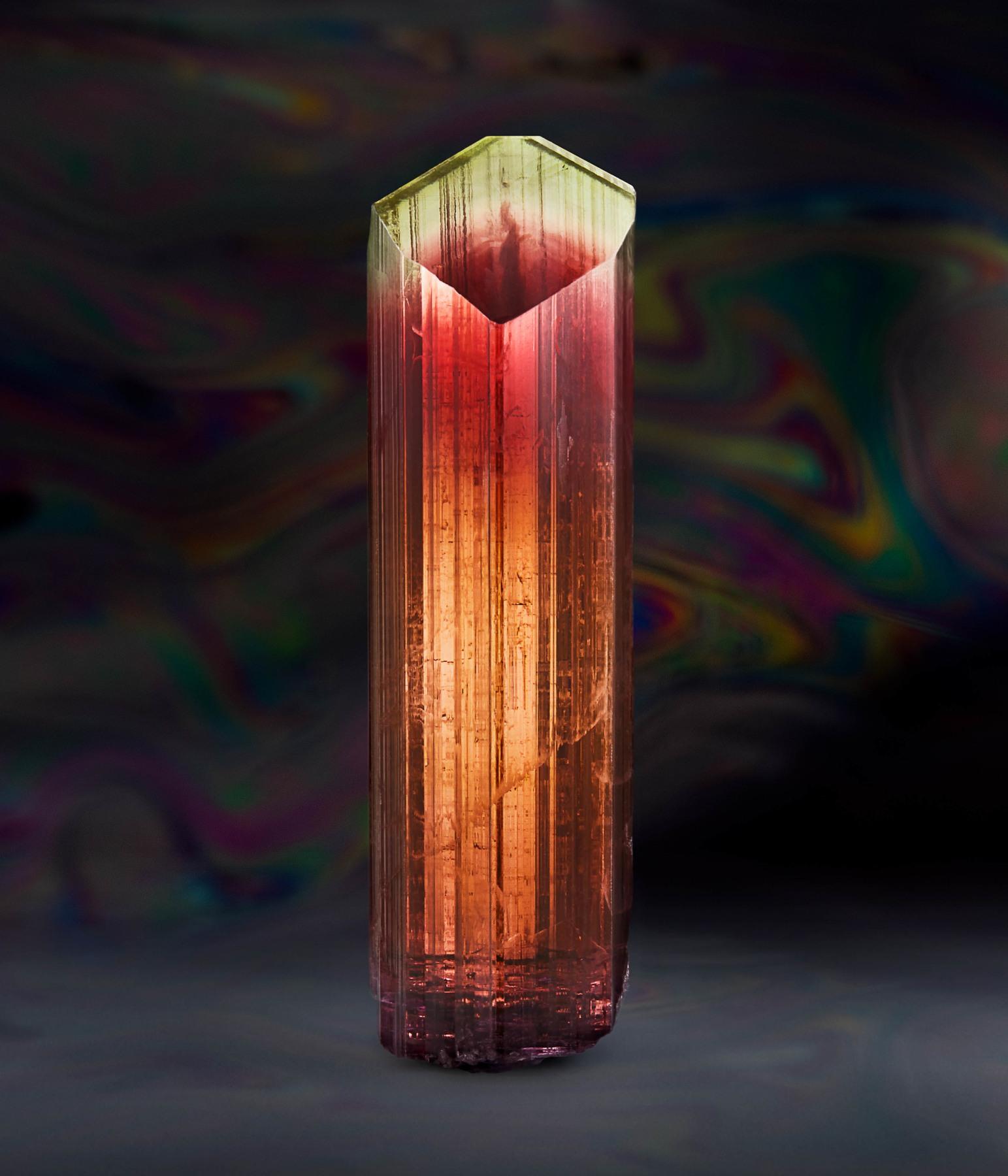 Tourmaline, Ofiki, Oyo State, Nigeria
6.3 cm tall x 1.9 cm diameter

Ofiki is well known for producing deep colored tourmalines. Most of the tourmalines they find are dull, rounded, and waterworn crystals, which are best used by jewelers as cutting