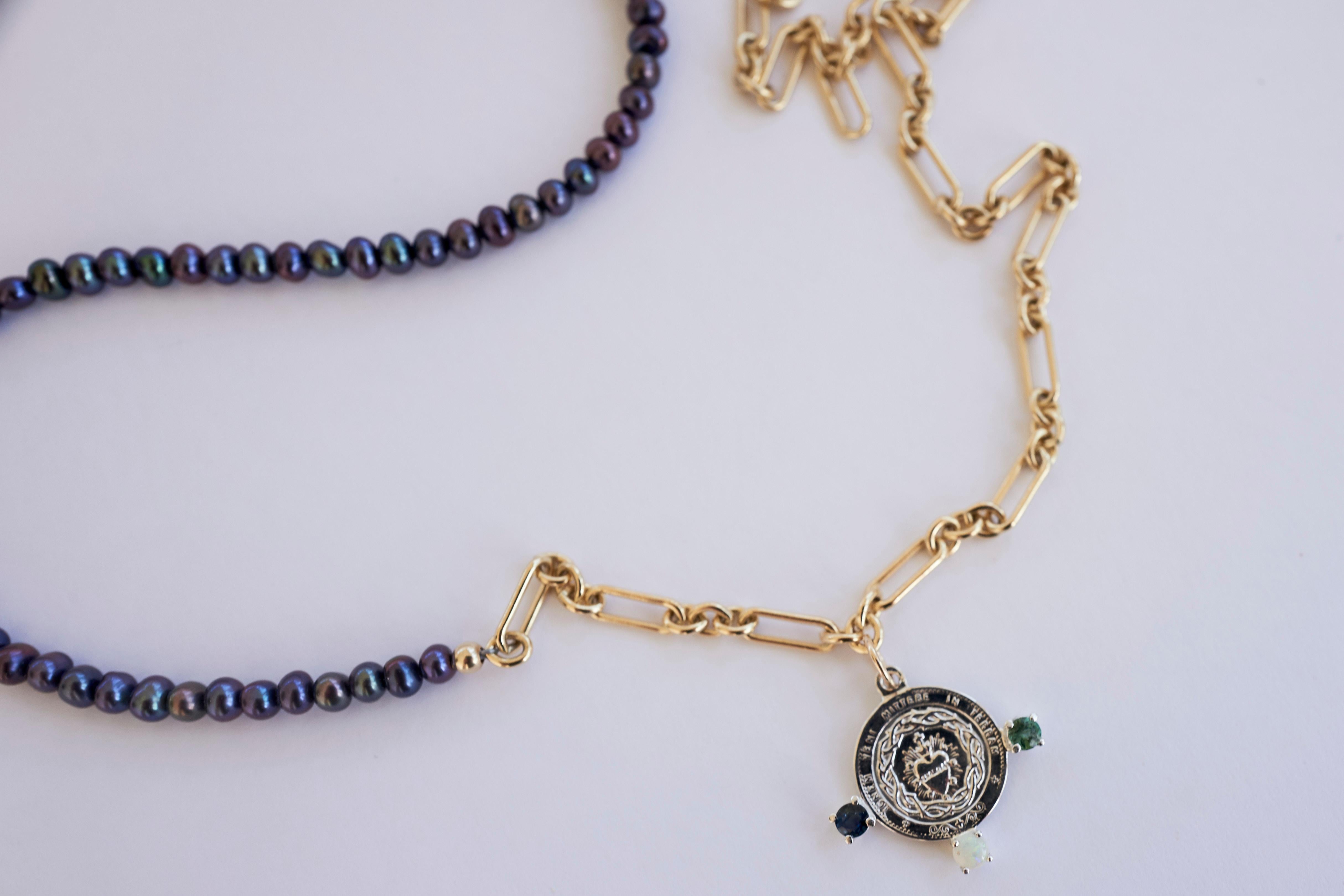 Opal Blue Green Tourmaline Sacred Heart Medal Coin Silver Black Pearl Tanzanite Beads Gold Filled Chain Necklace

The Sacred Heart (also known as the Sacred Heart of Jesus) has one of the deepest meanings in the Roman Catholic practice. The symbol