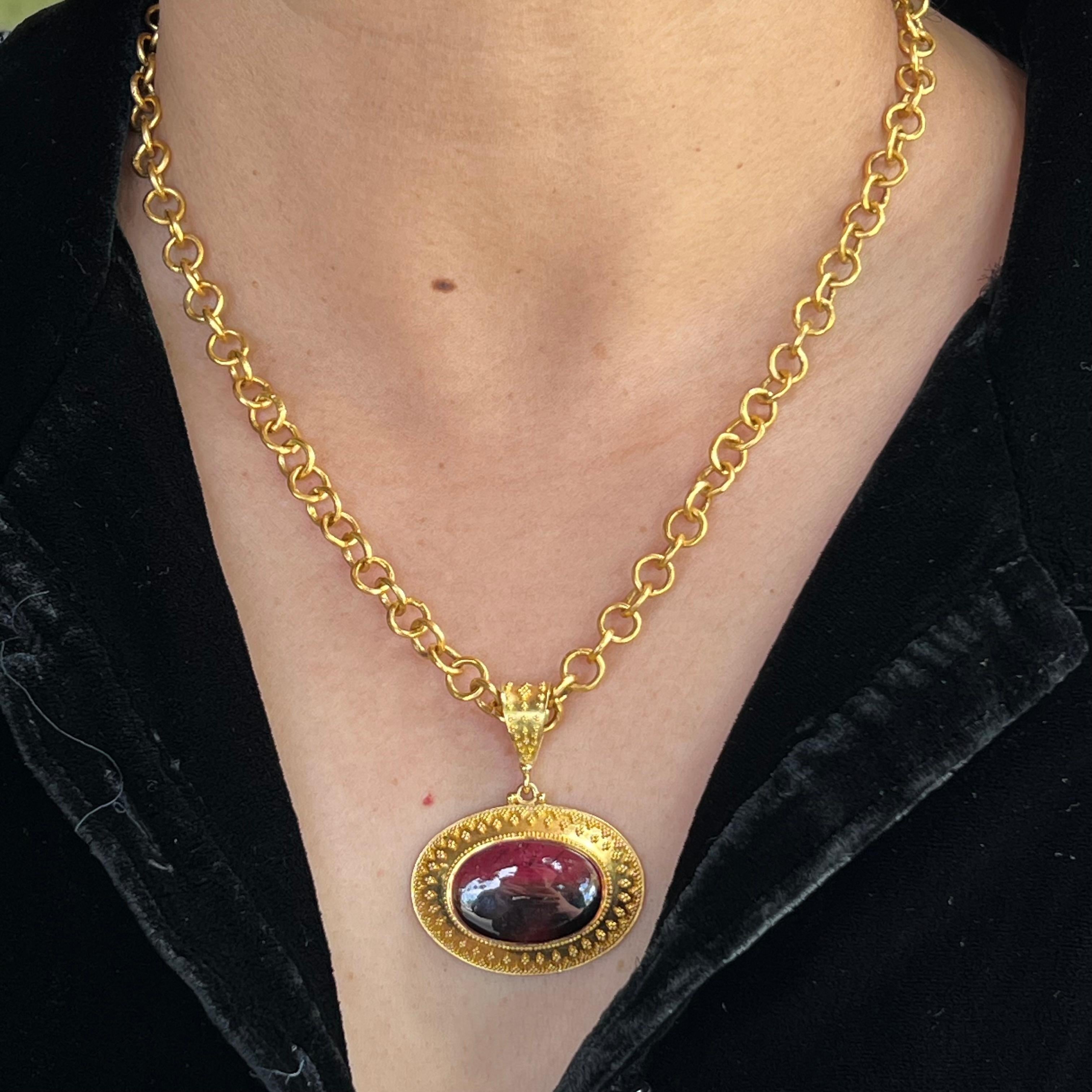 This stunning pendant is a watermelon tourmaline set in 18 karat gold. The intricate beading detail accents this exotic stone. (The chain is not included.)
