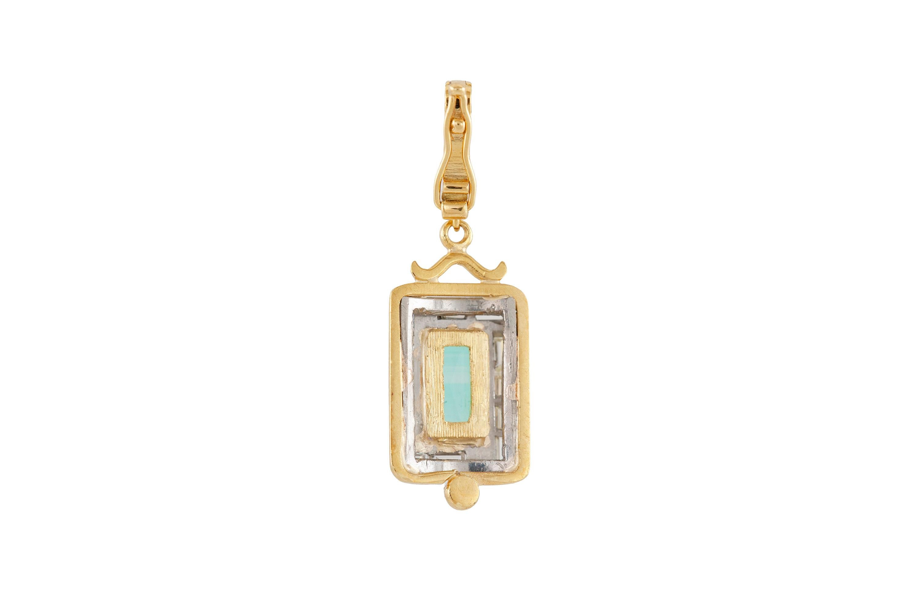 Rectangular pendant finely crafted in 18k yellow gold, with tourmaline and diamonds weighing a total of 1.50 dwt. Circa 1920.