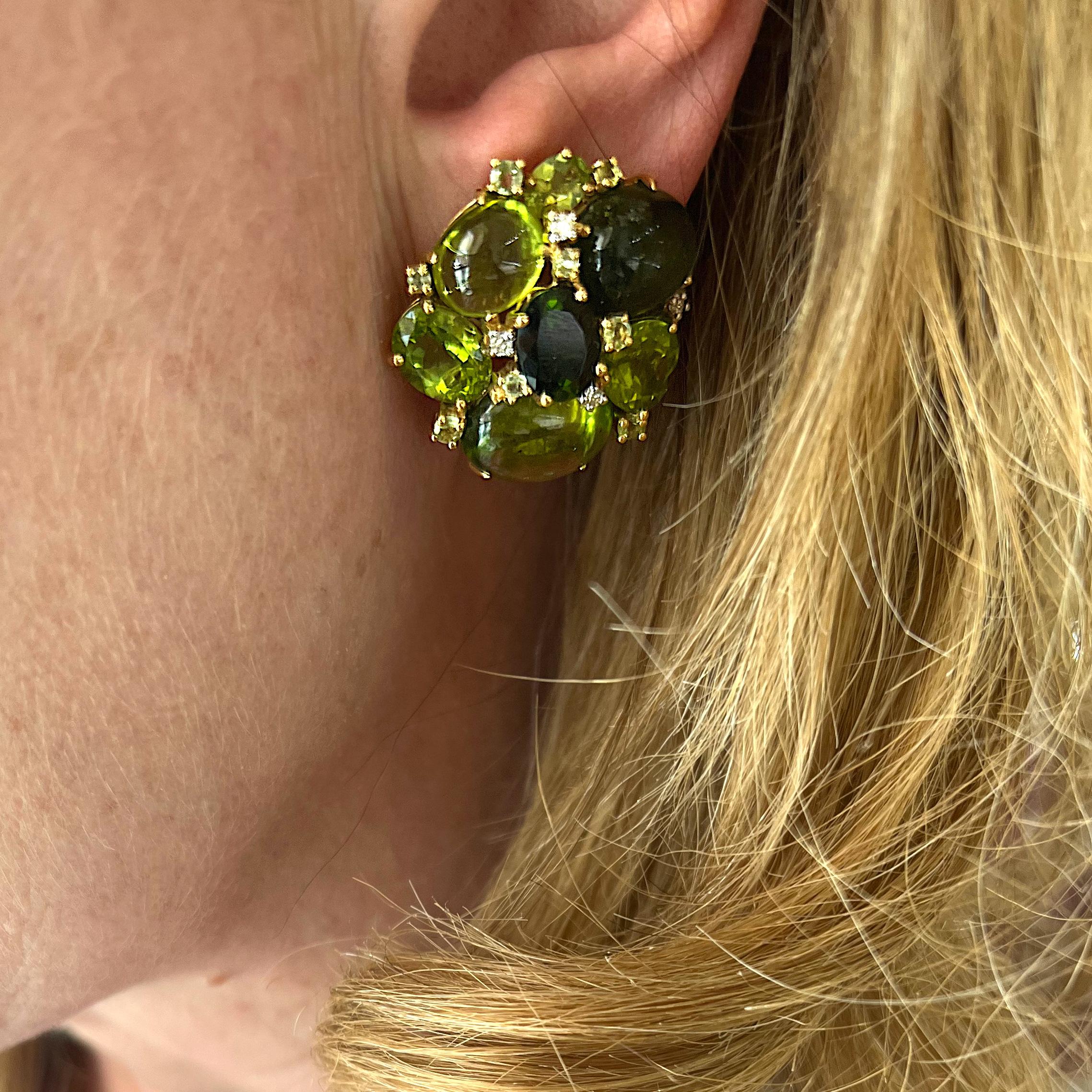 A pair of tourmaline and peridot earrings, mounted in 18ct gold, set with mixed cuts of green tourmaline, with a total weight of 15.40ct, peridot, with a total weight of 32.31ct and round brilliant-cut diamonds with a total weight of 0.23ct.