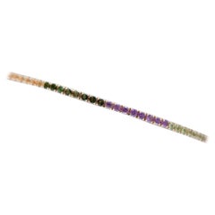 Bracelet tennis en or rose avec tourmalines, péridots, topazes, améthystes